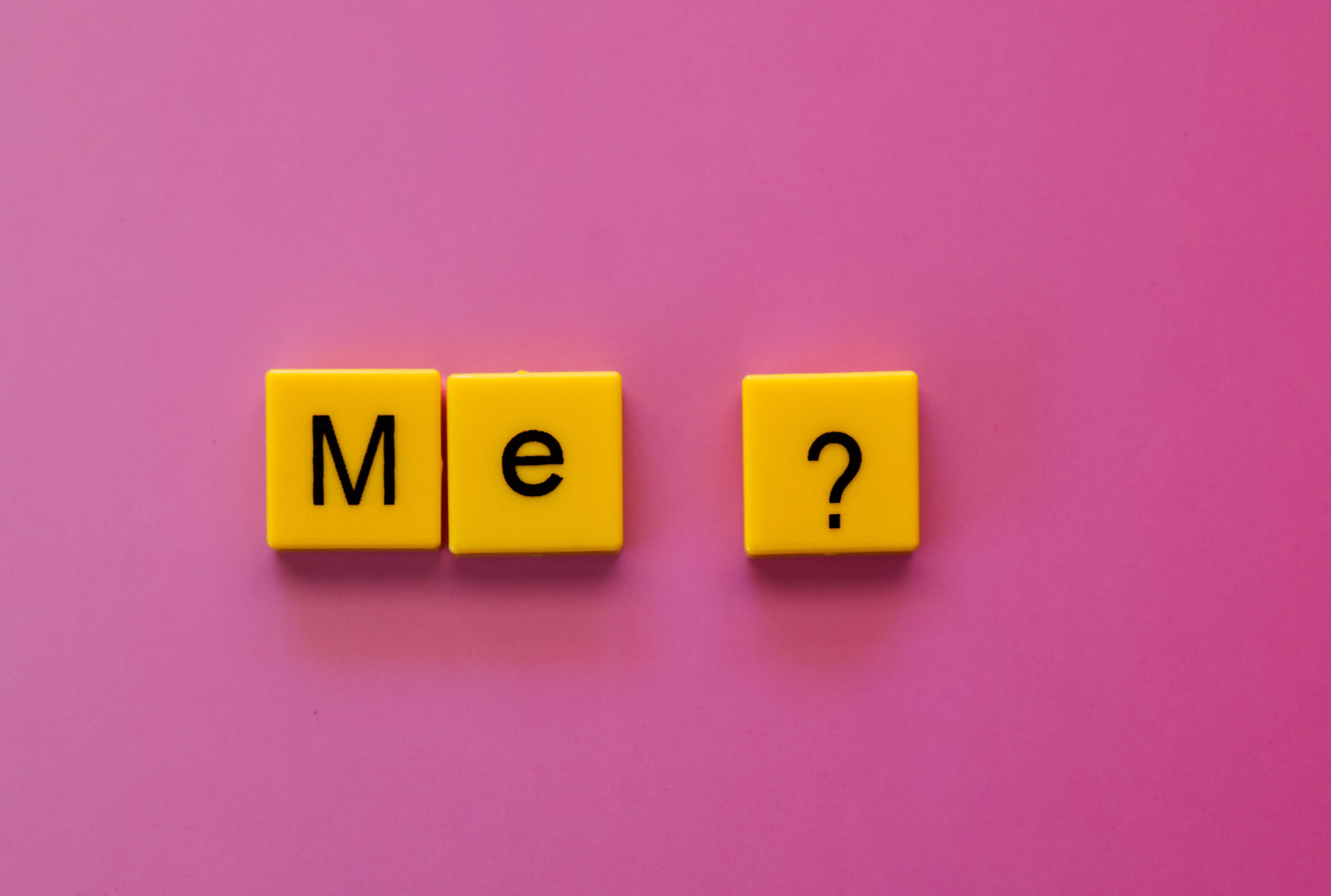 tile floor scrubber machine Yellow letter tiles forming 'Me?' against a vibrant pink background, offering a playful concept.