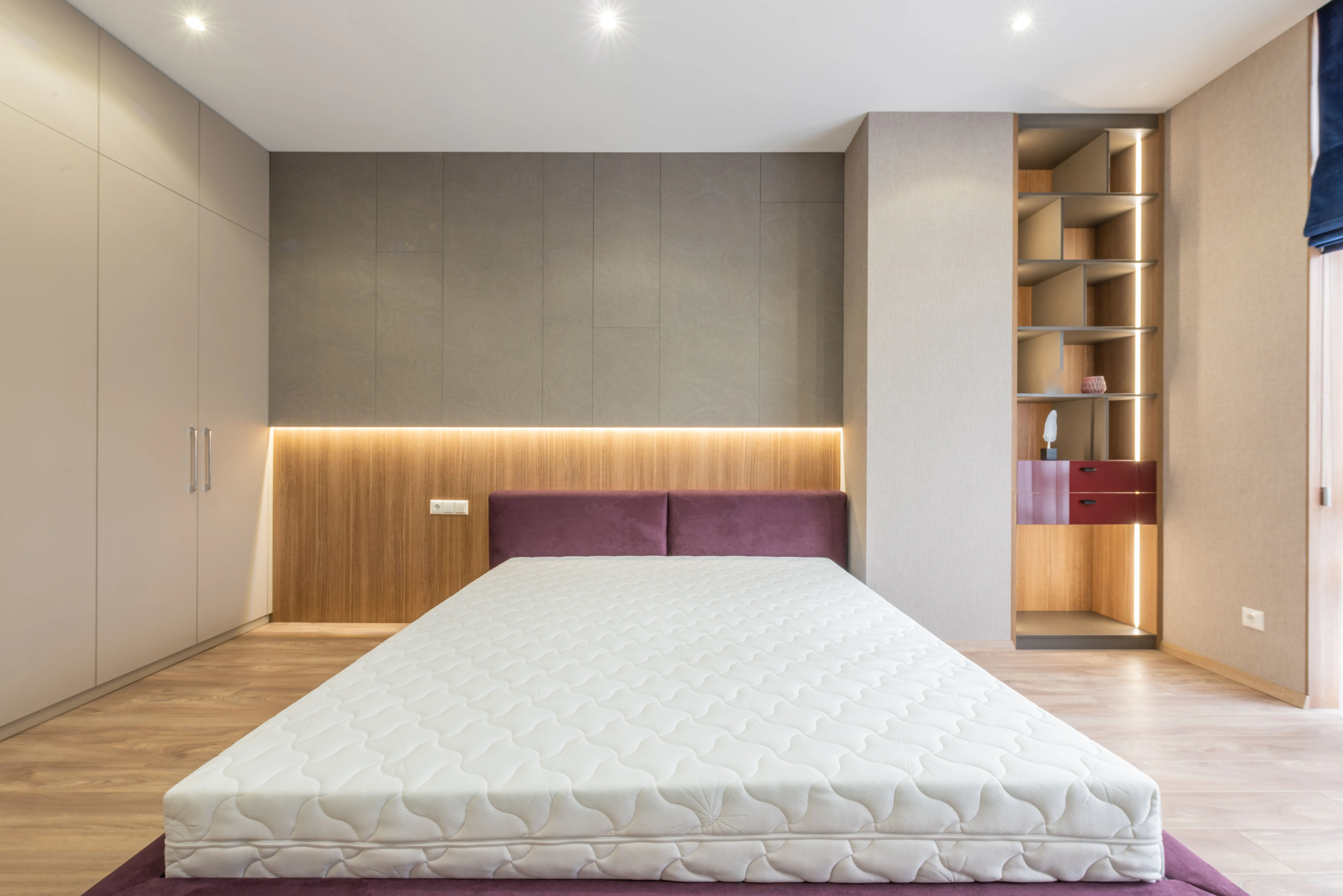 california king bed frame with storage Modern interior design of empty bedroom with cozy king size bed without sheets and empty closets