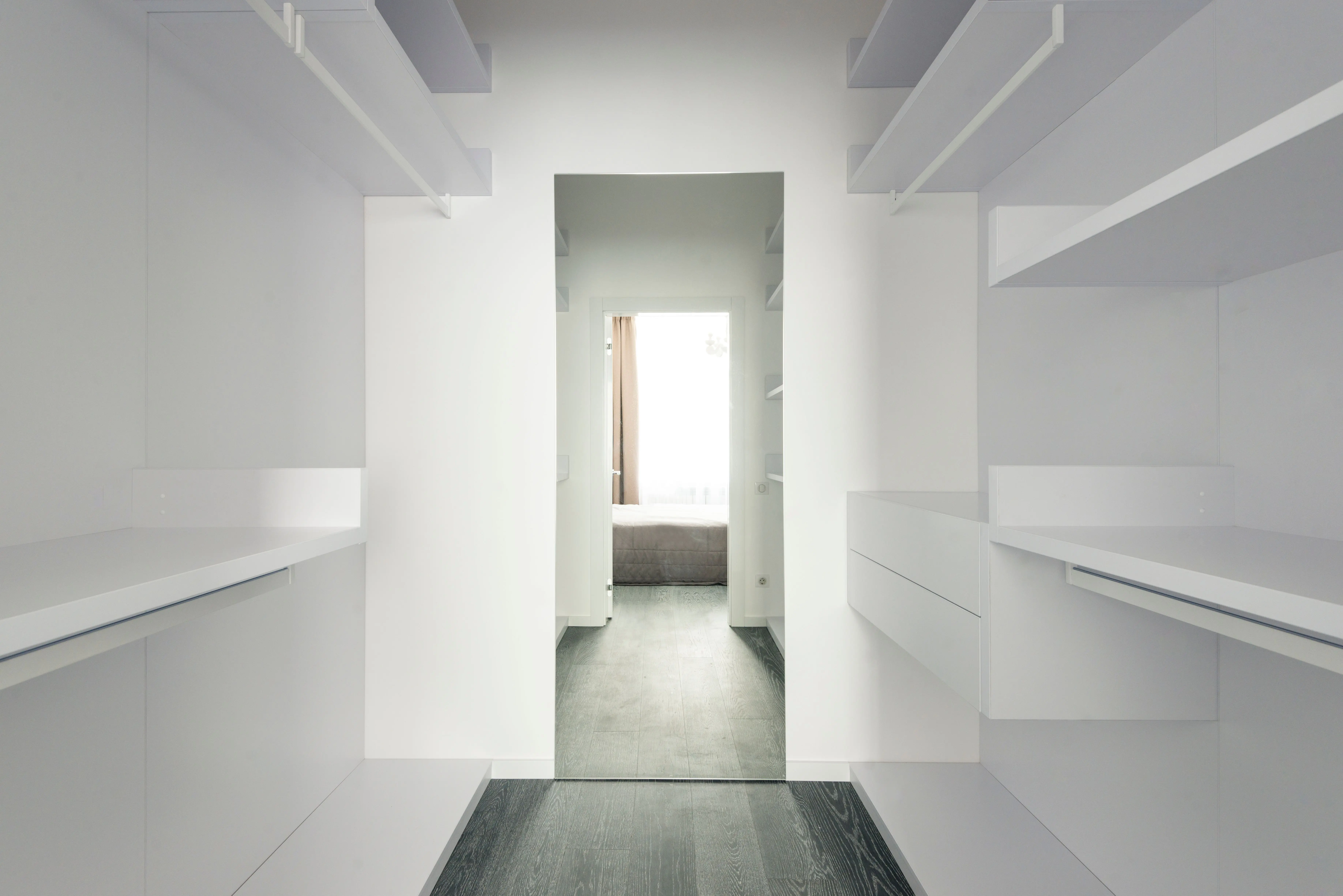 solid wood armoire wardrobe Bright and spacious modern minimalist walk-in closet with open shelving.