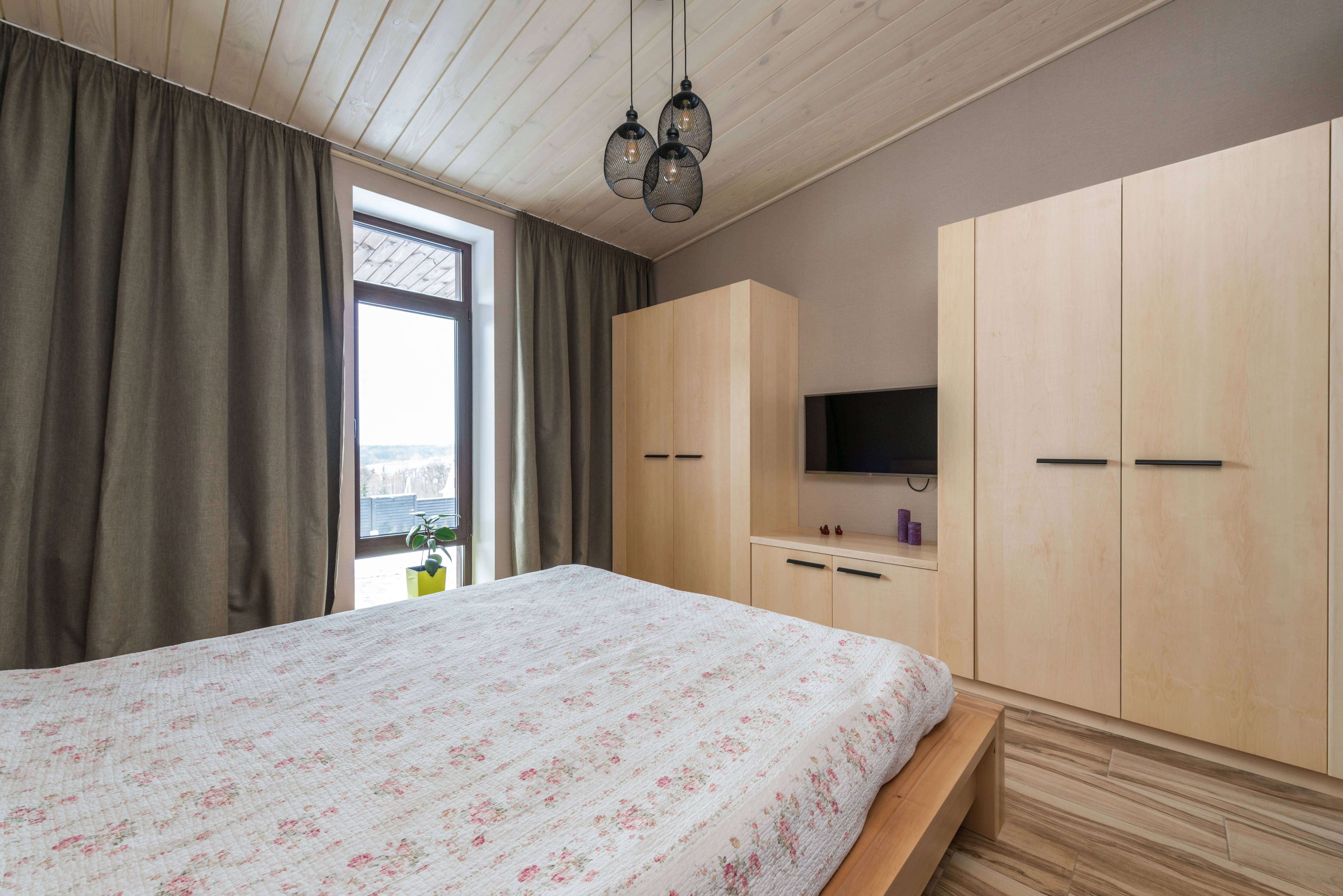 california king bed frame with storage Inviting bedroom showcasing modern interior design with warm wooden elements and natural light.