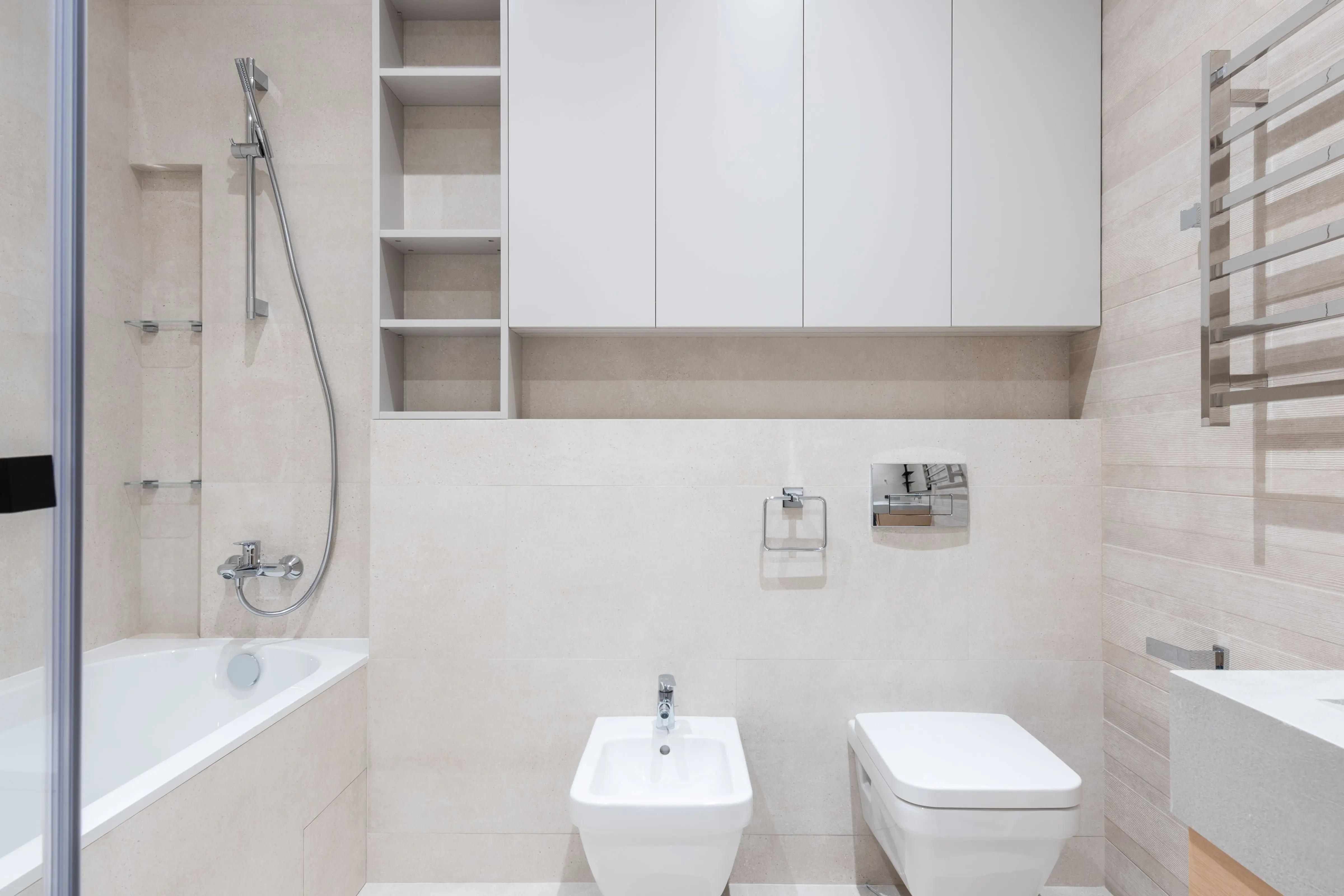 vanity shelves Interior of modern light bathroom with bidet and toilet next to sink and bath