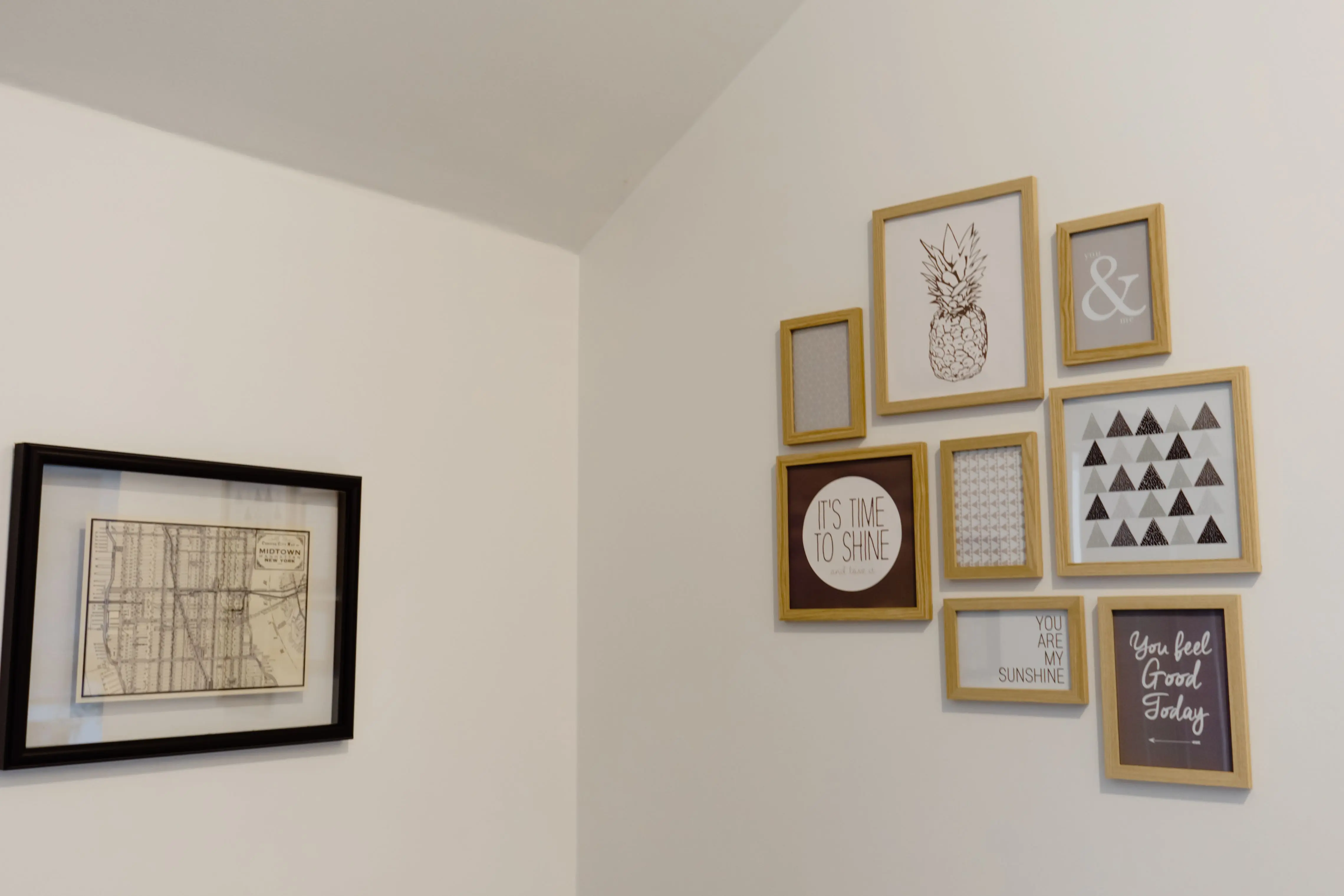 coastal wall decor A chic arrangement of picture frames on a white wall adds a modern touch to your space.