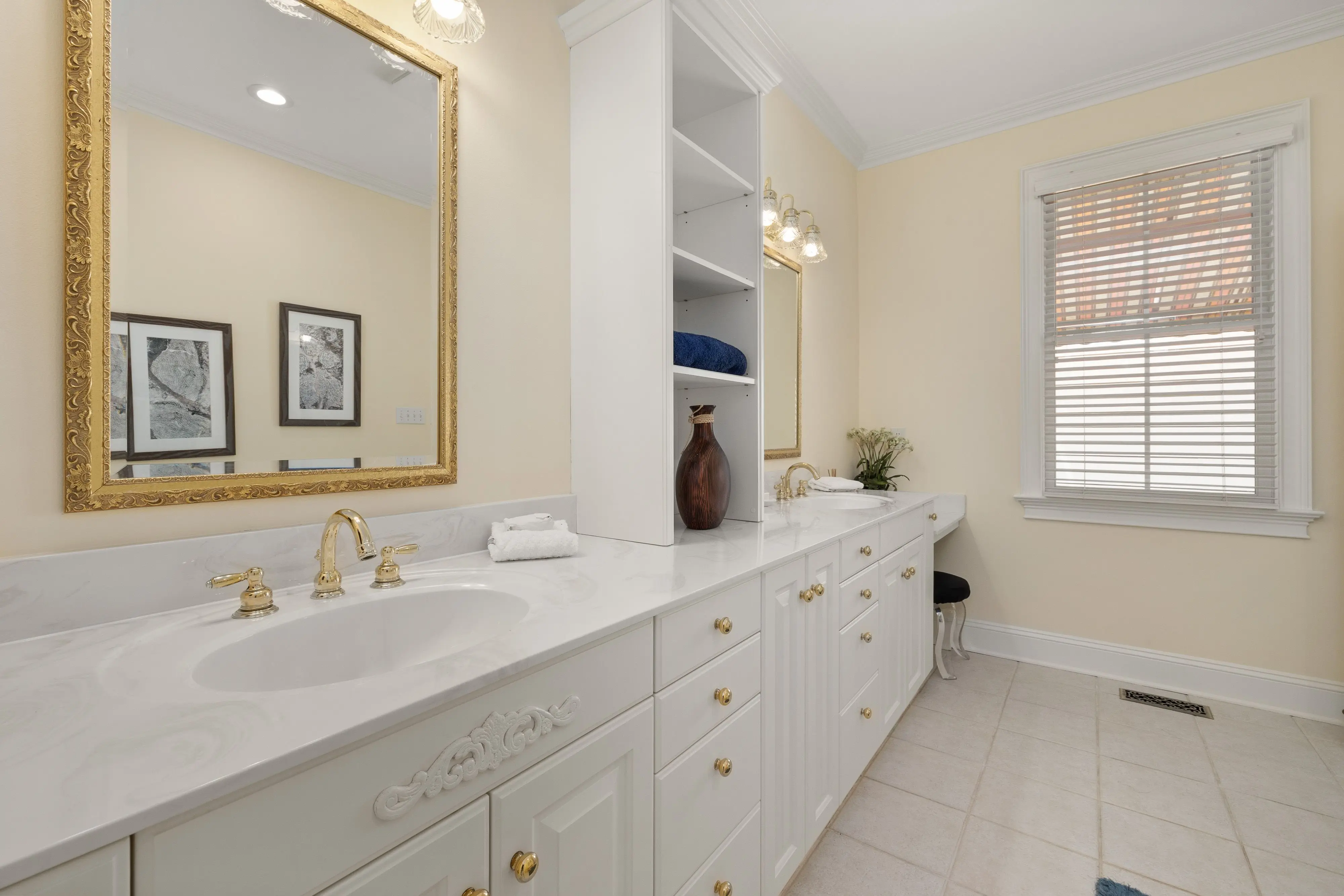 double bathroom vanities Spacious bathroom with a double vanity, gold accents, and stylish decor creating a luxurious ambiance.