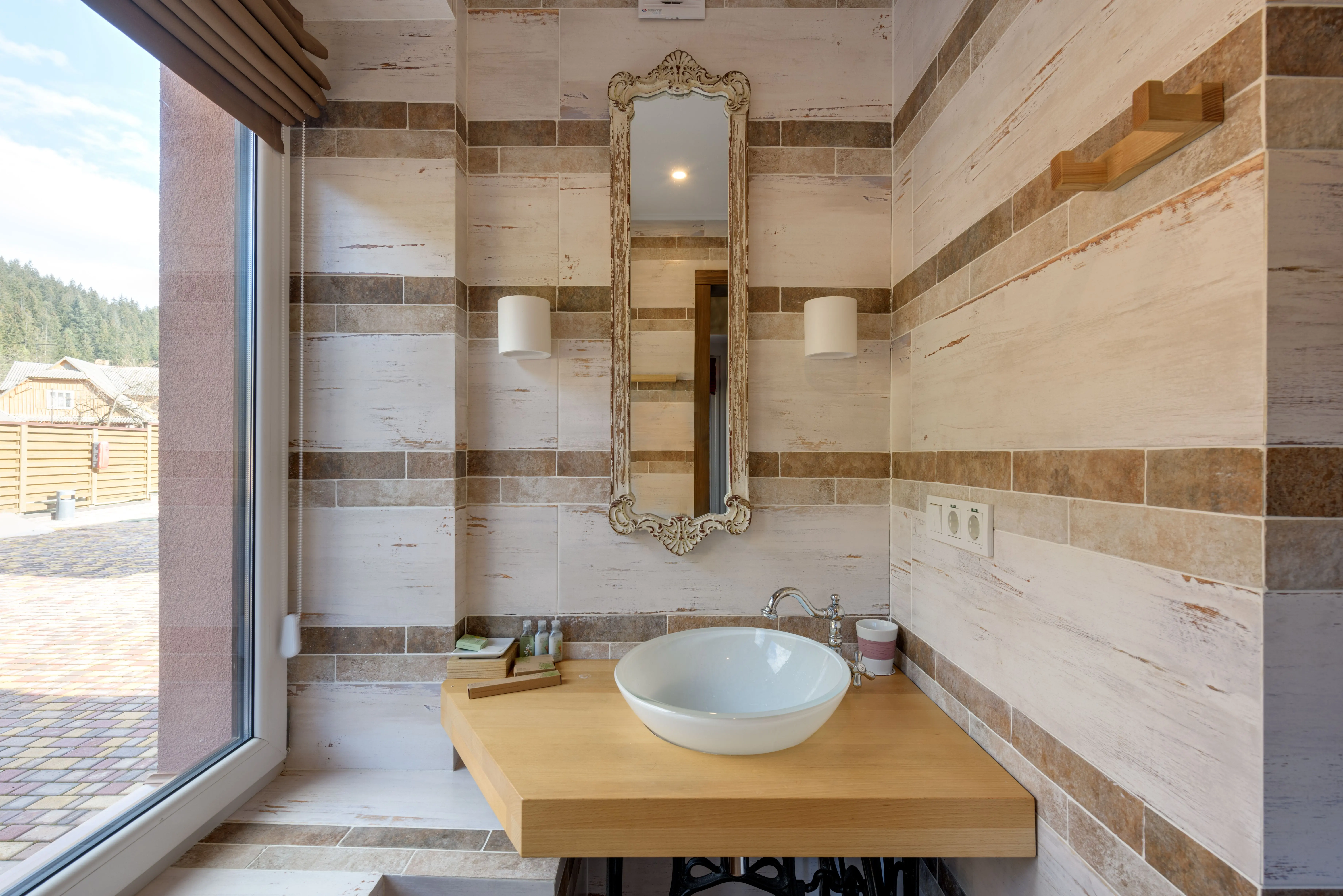 wood bathroom vanities Modern bathroom interior featuring a washbasin and decorative mirror.