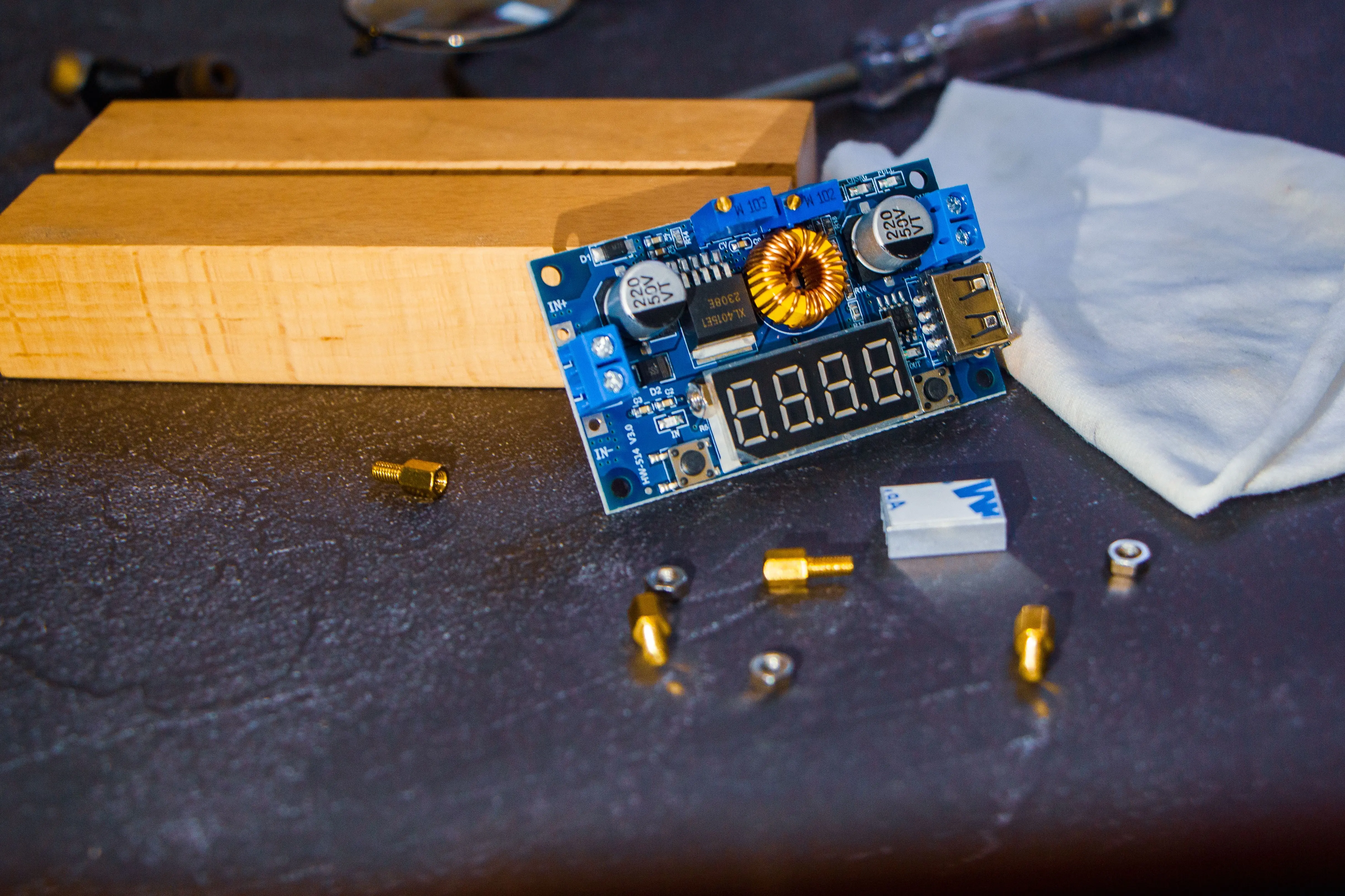 christmas craft kits Detailed view of a circuit board and electronic components on a table.