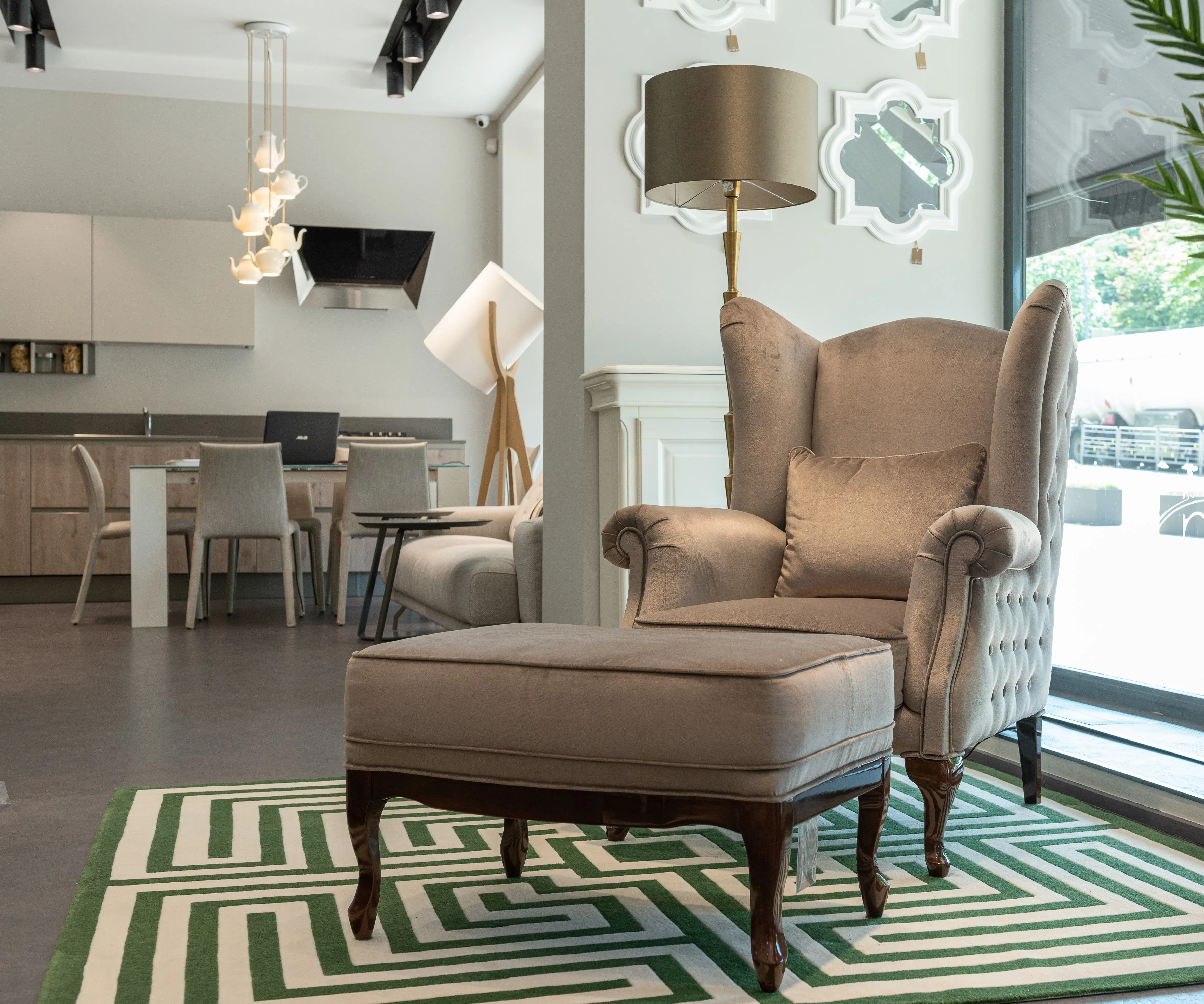 pouf coffee table Comfortable armchair with cushion and soft ottoman on carpet near modern dining room with furniture in spacious apartment