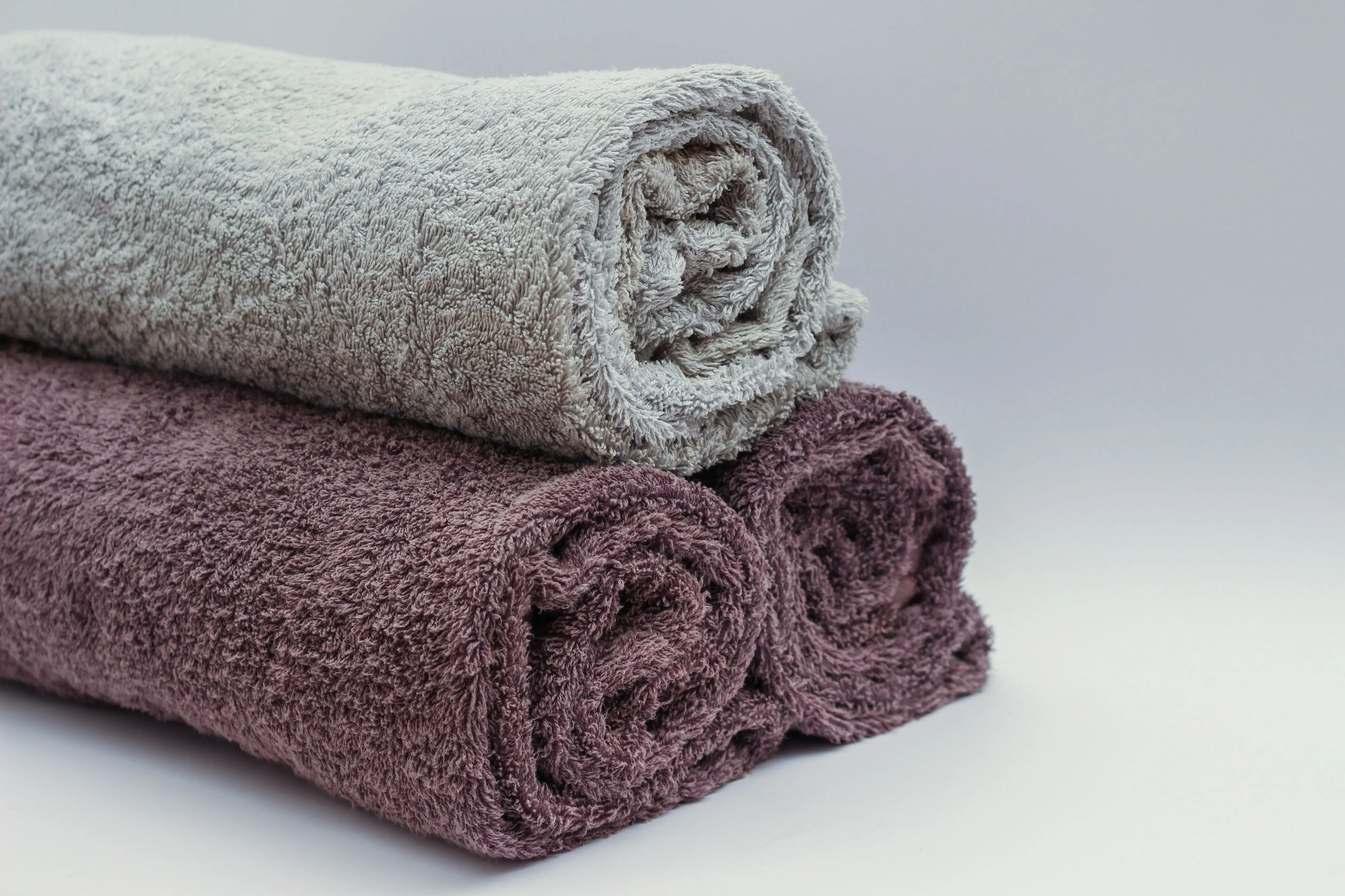 and paper towels Close-up of rolled bathroom towels in neutral tones, ideal for interior design or spa themes.