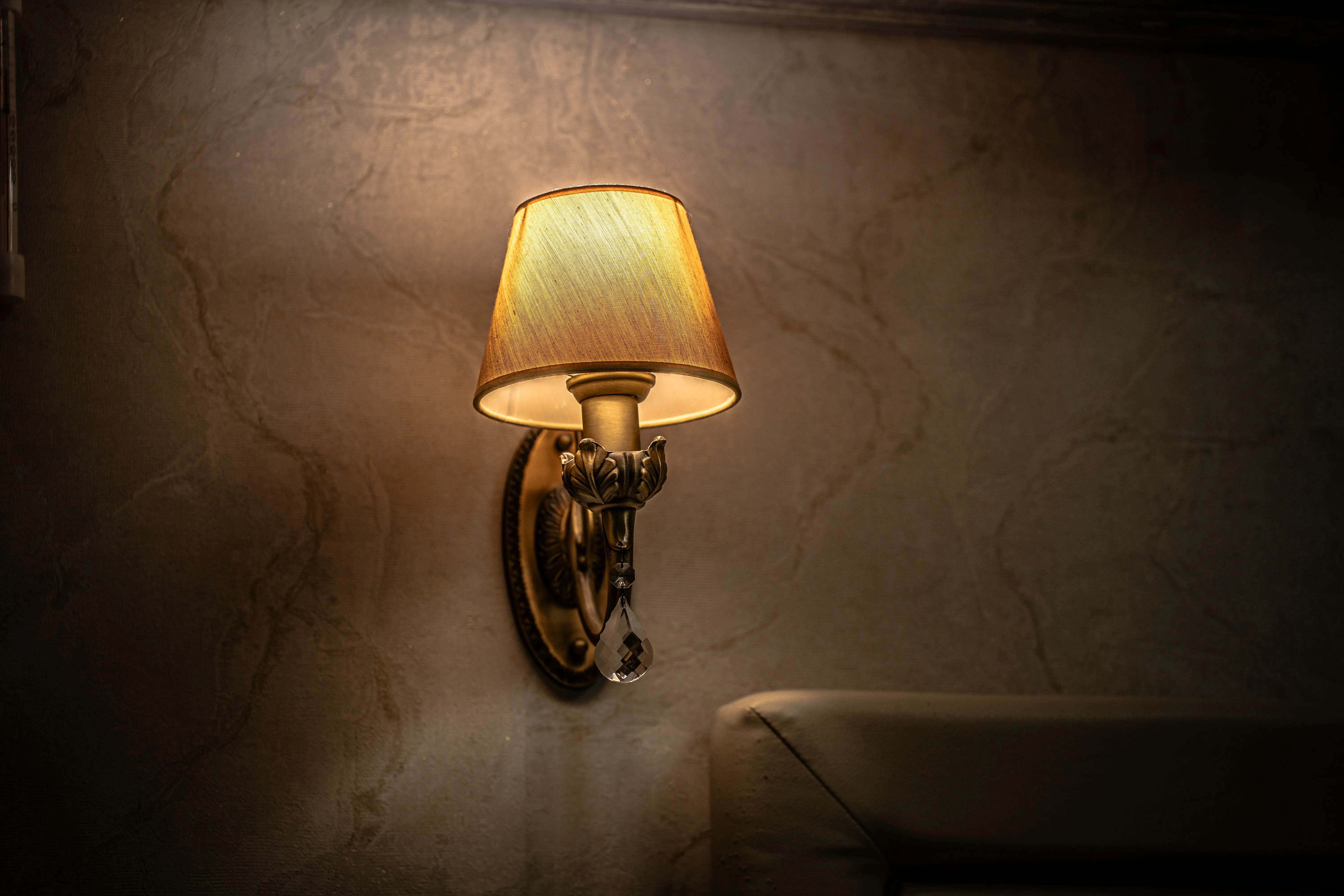 sconce outdoor wall light Vintage wall sconce casting a warm and cozy glow in an indoor setting, perfect for ambiance.