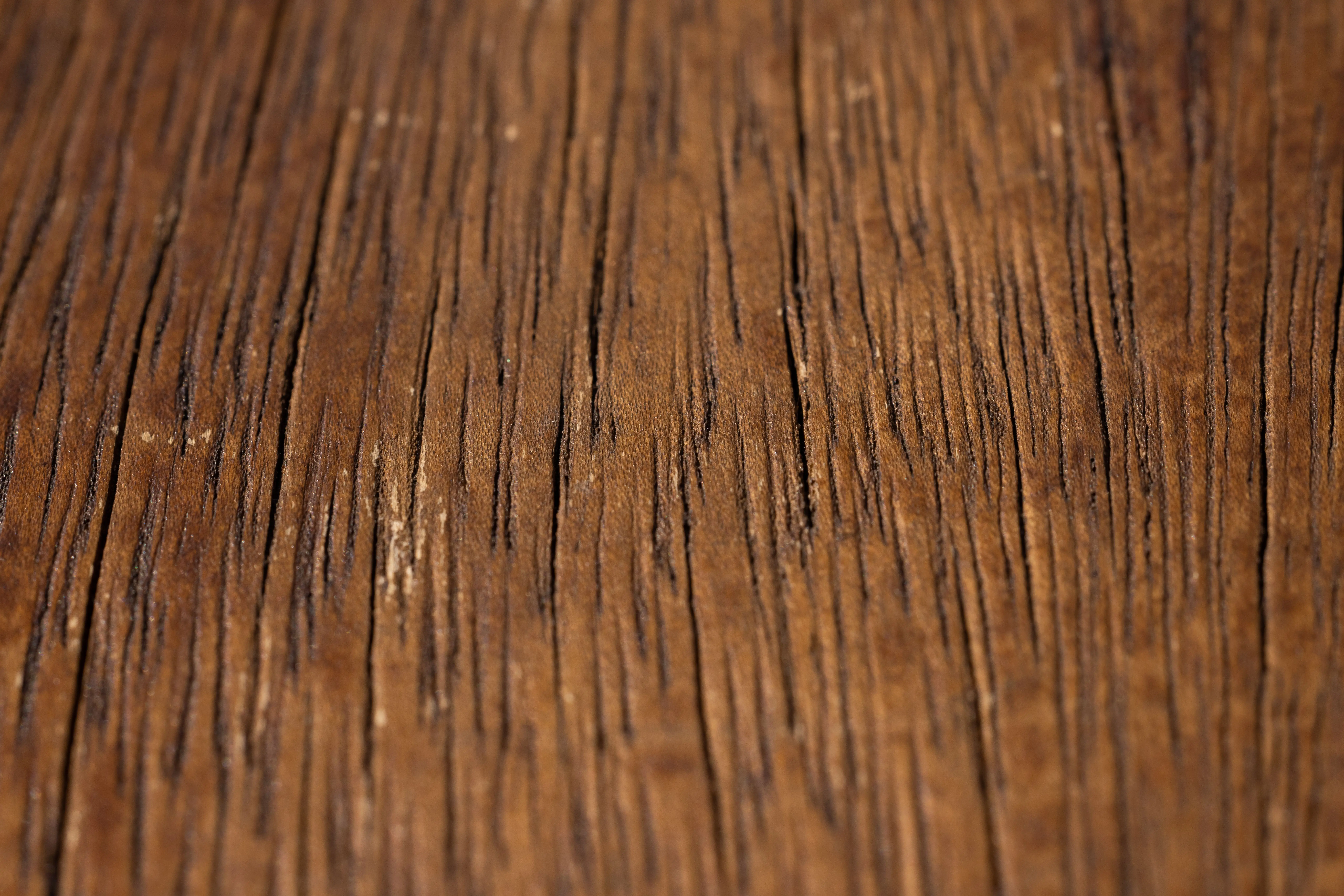 wood outdoor chairs Detailed close-up of a rustic wooden surface showing natural grain and texture.