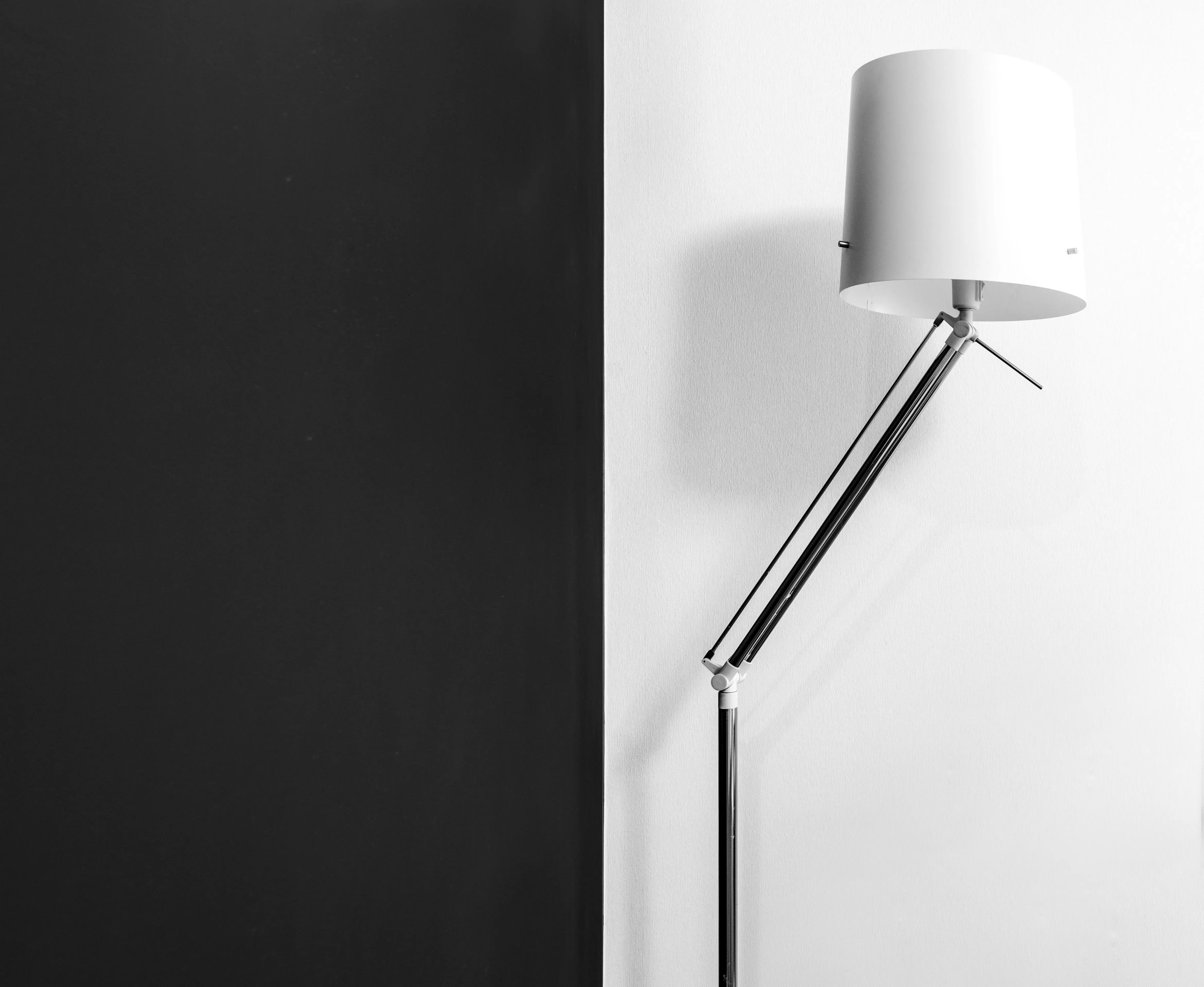 white table lamp Modern lamp with stylish design near wall with contrast black and white colors in dwell room