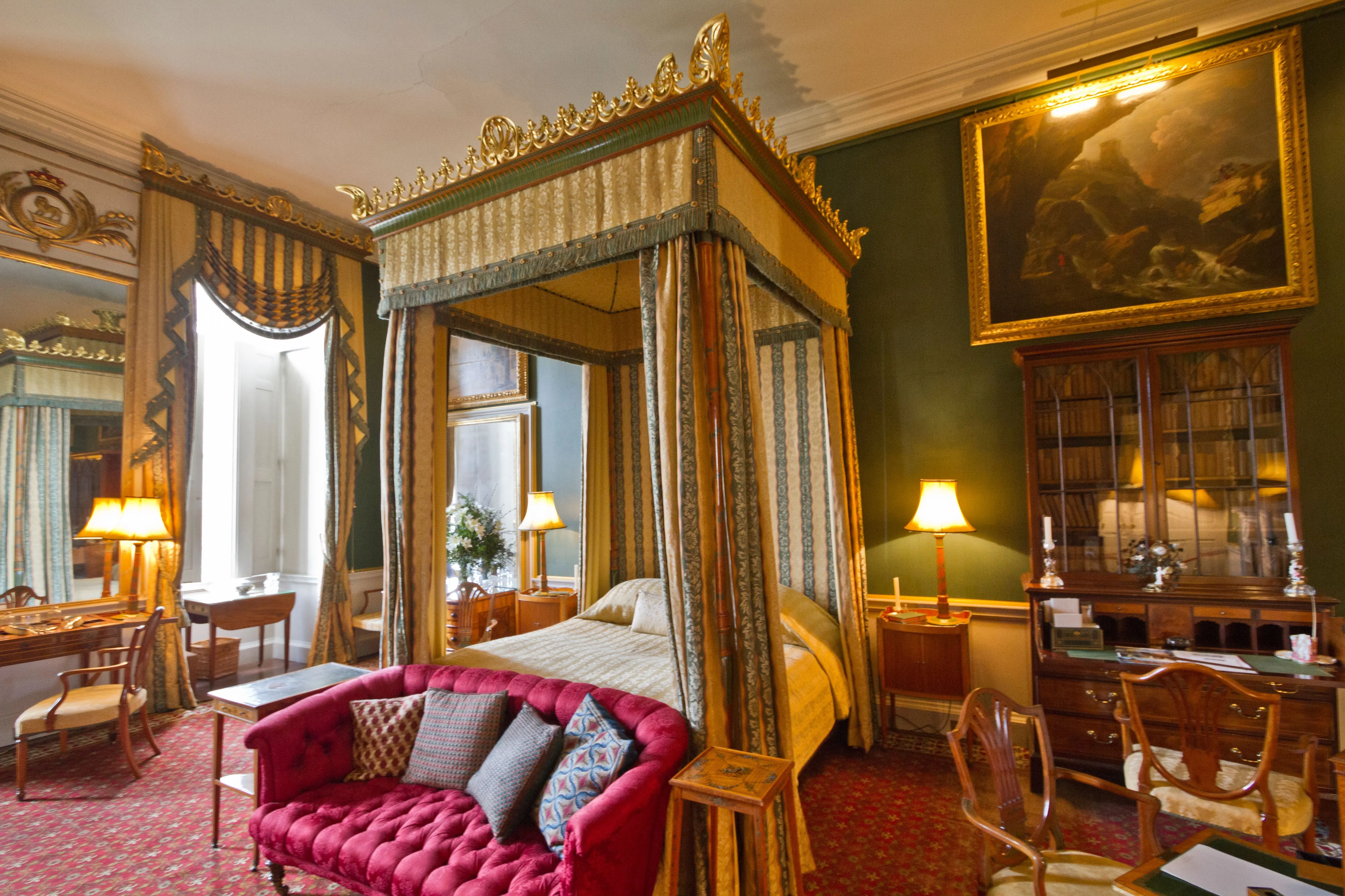 green wall paint Luxurious Victorian-style bedroom inside Castle Howard, showcasing ornate décor and rich furnishings.