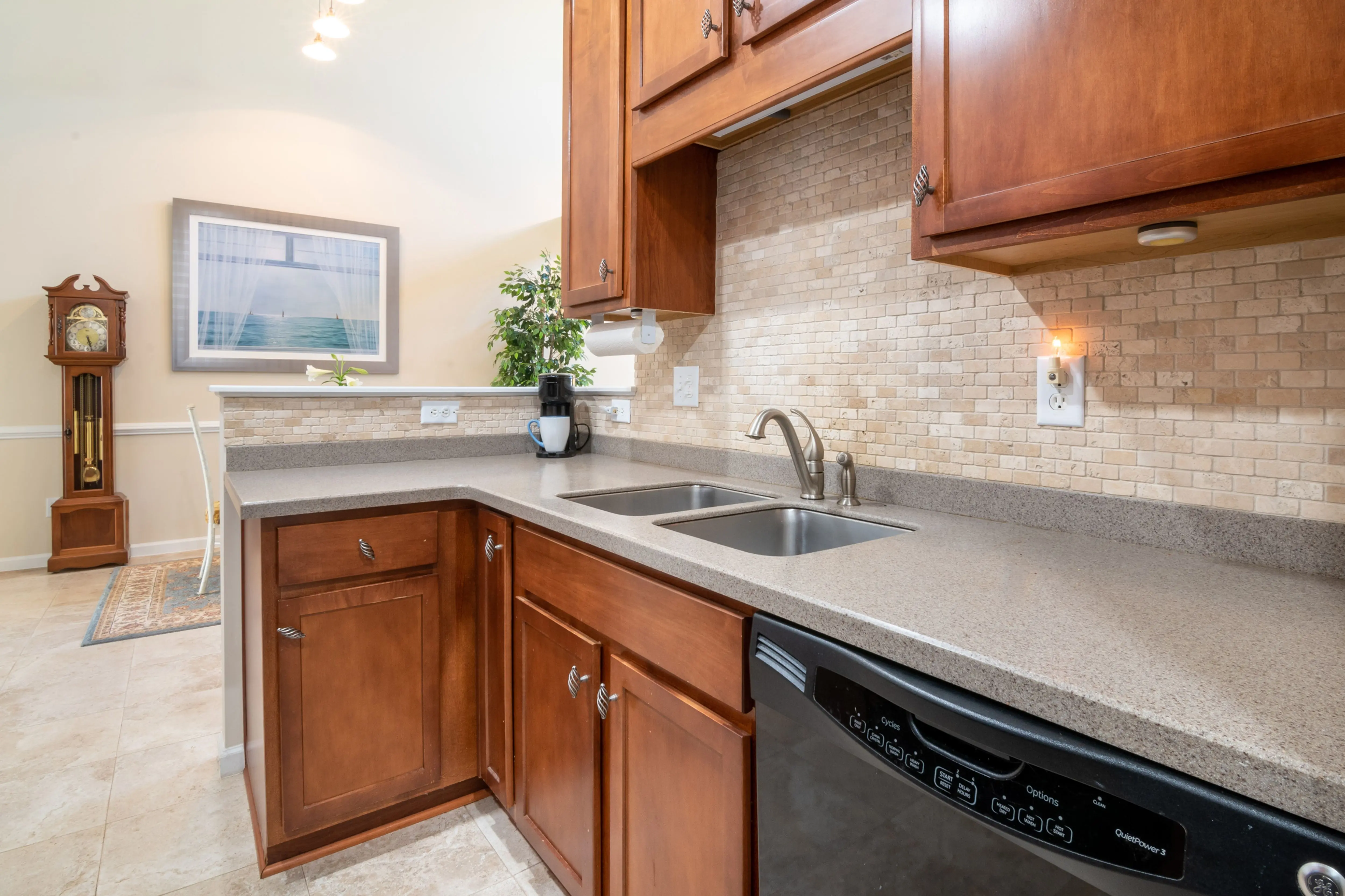 cherry wood cabinets Elegant kitchen interior showcasing granite countertops and wooden cabinets.