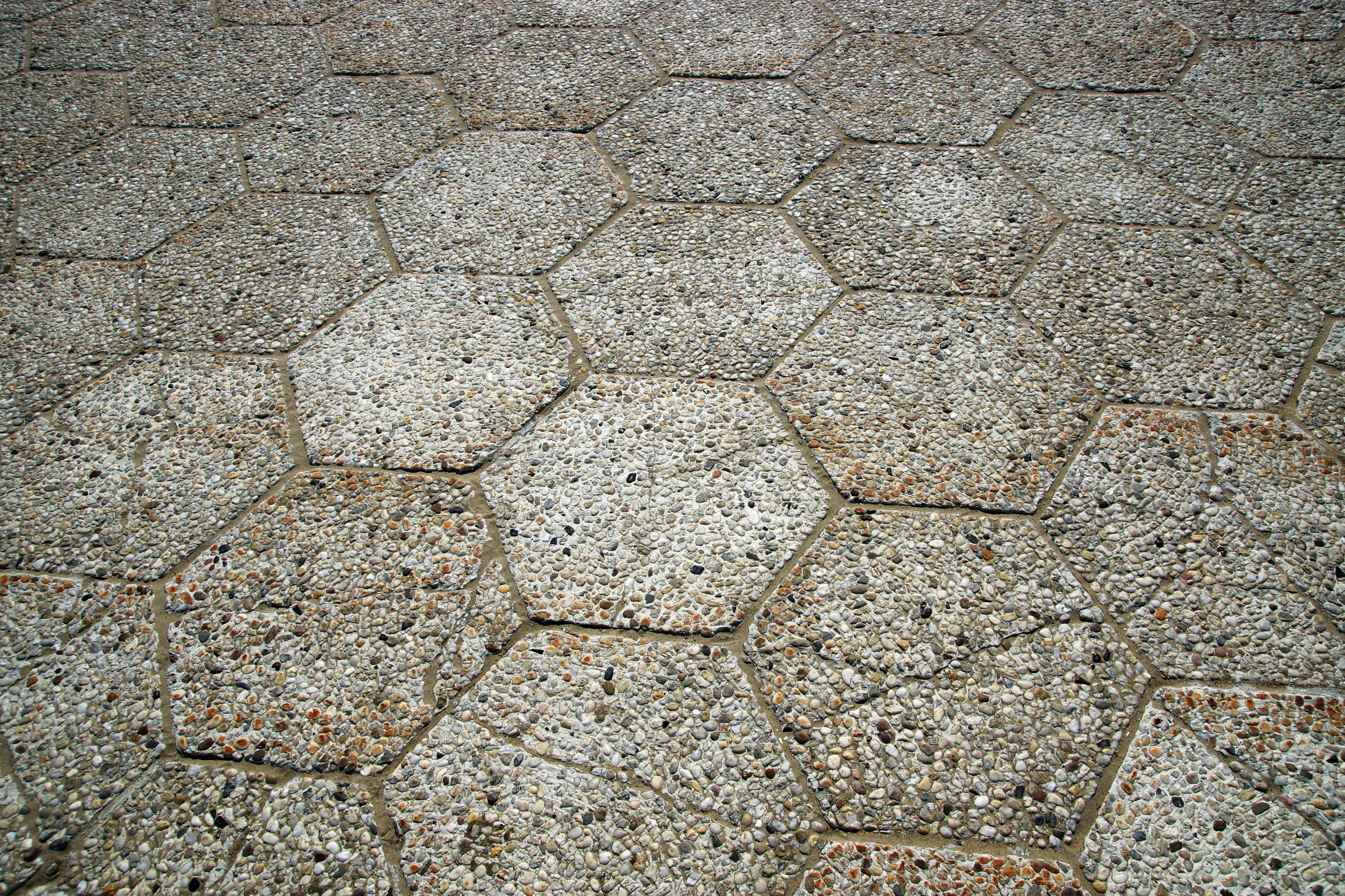 paver patterns Close-up view of hexagonal stone pavement showcasing textures and patterns.