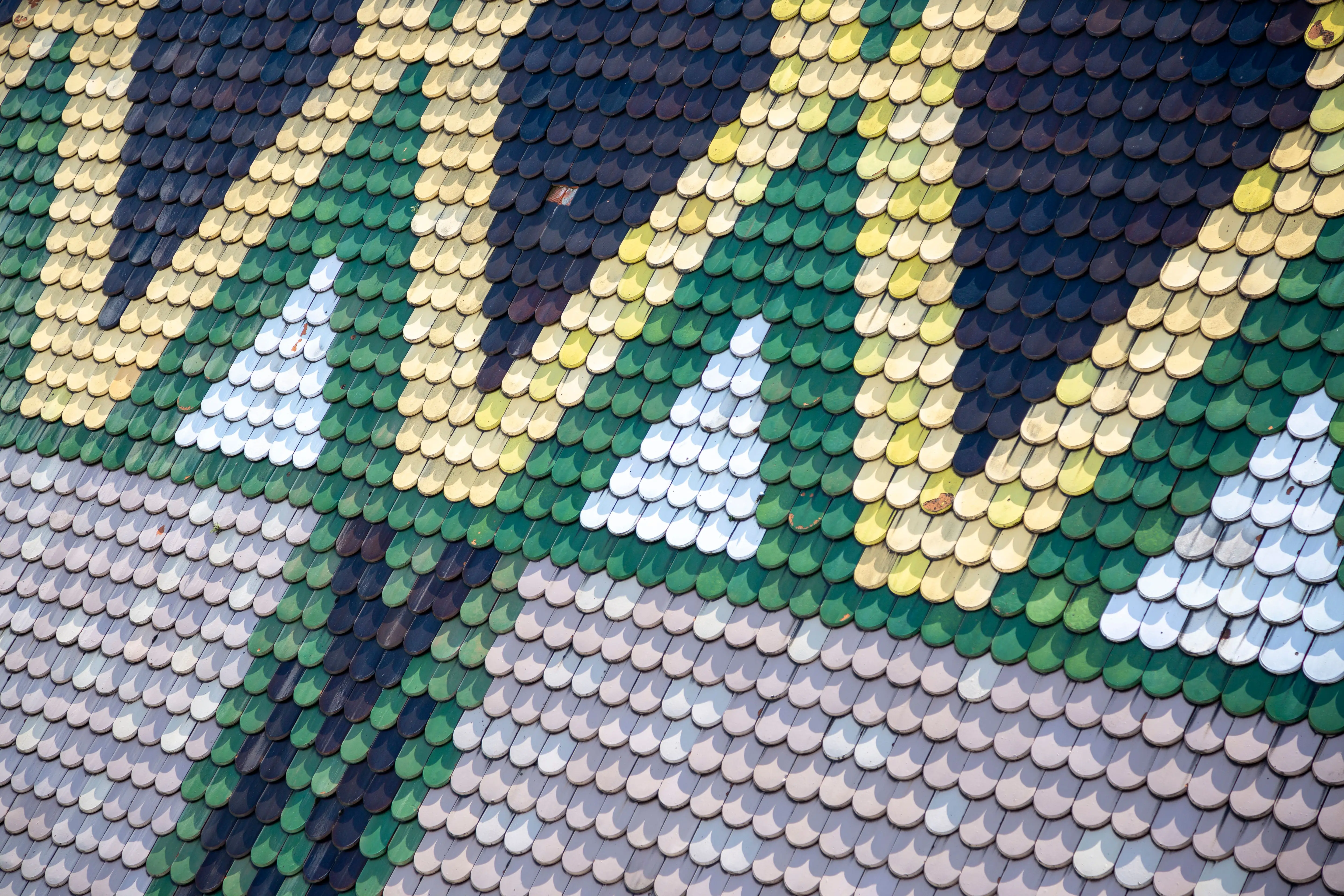 green tile backsplash Vibrant geometric tile pattern on European roof showcasing intricate design.