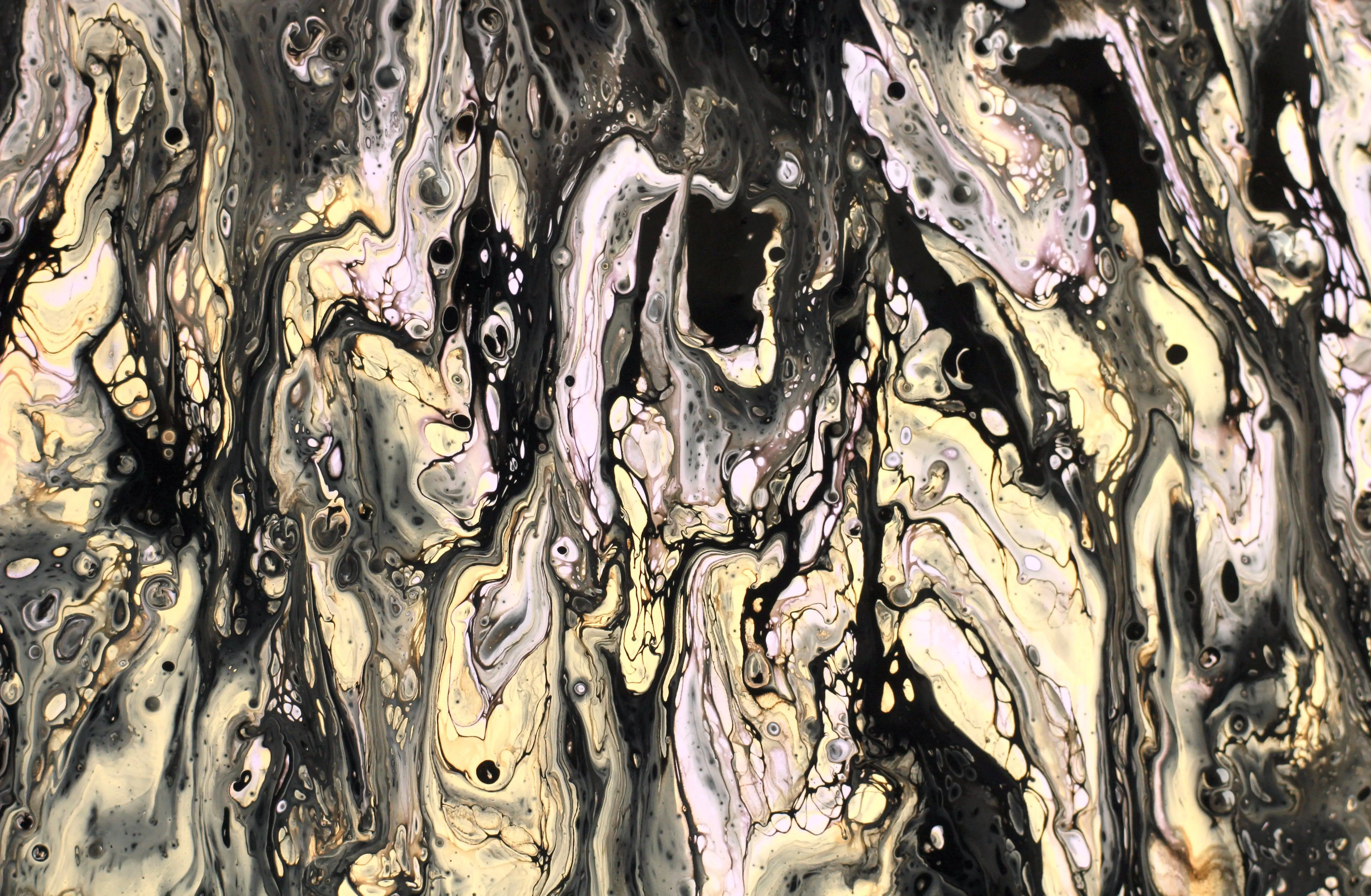 gold wall art Dynamic abstract fluid art in black, white, and gold with swirling patterns and textures.