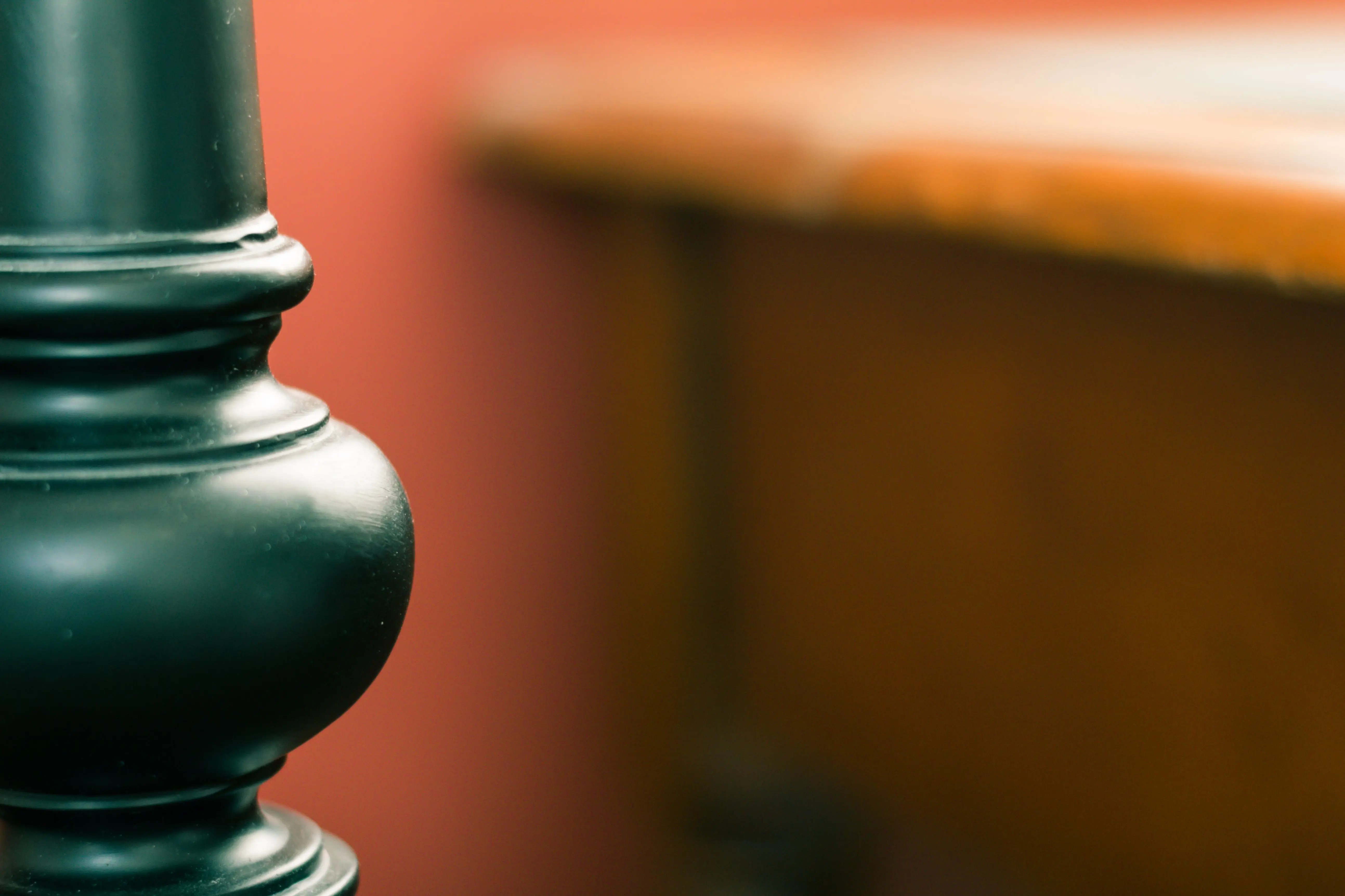metal desk legs Elegant close-up of a black ceramic object with blurred background for artistic effect.