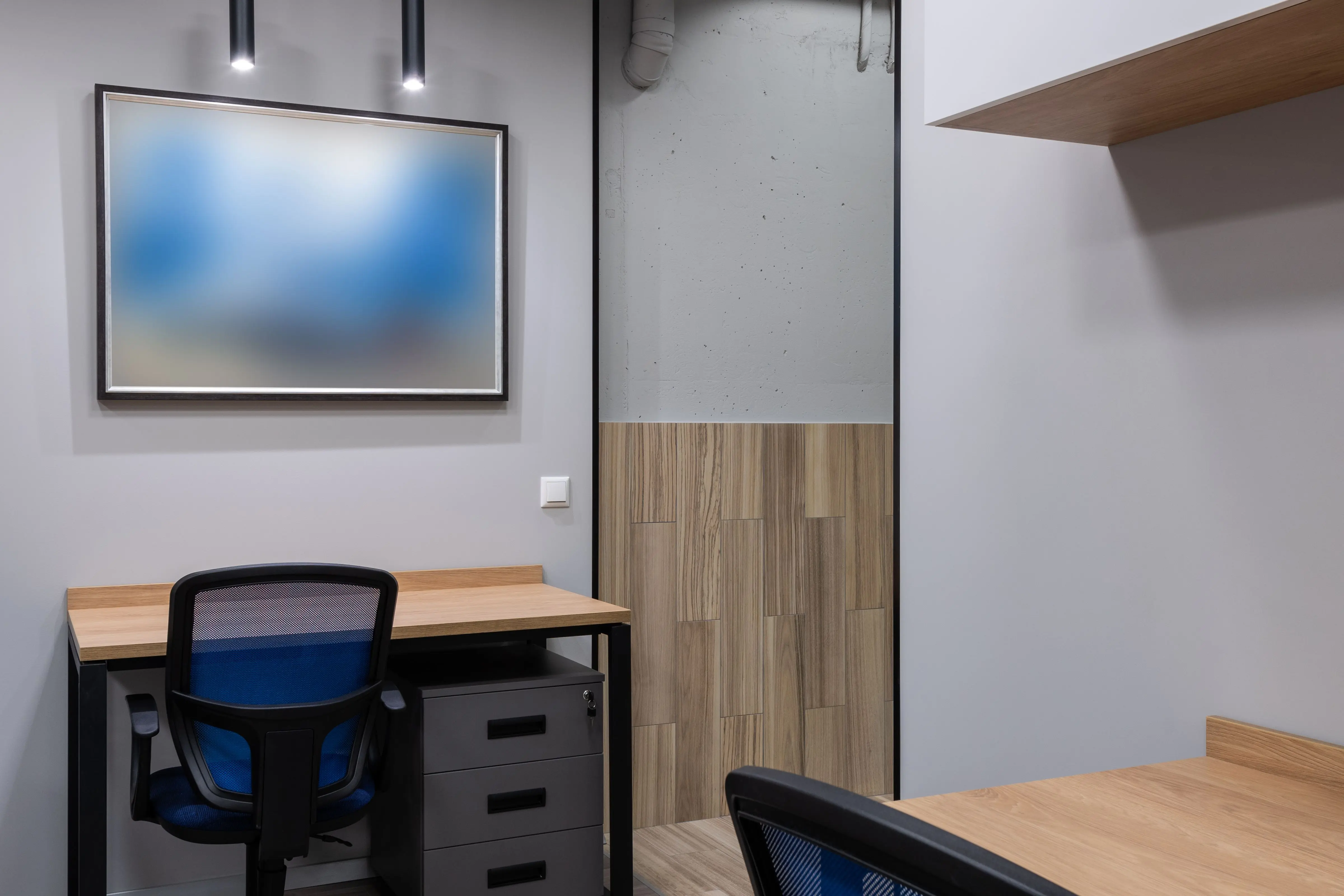 industrial furniture Sleek and contemporary office space with minimalist design elements, perfect for work efficiency.