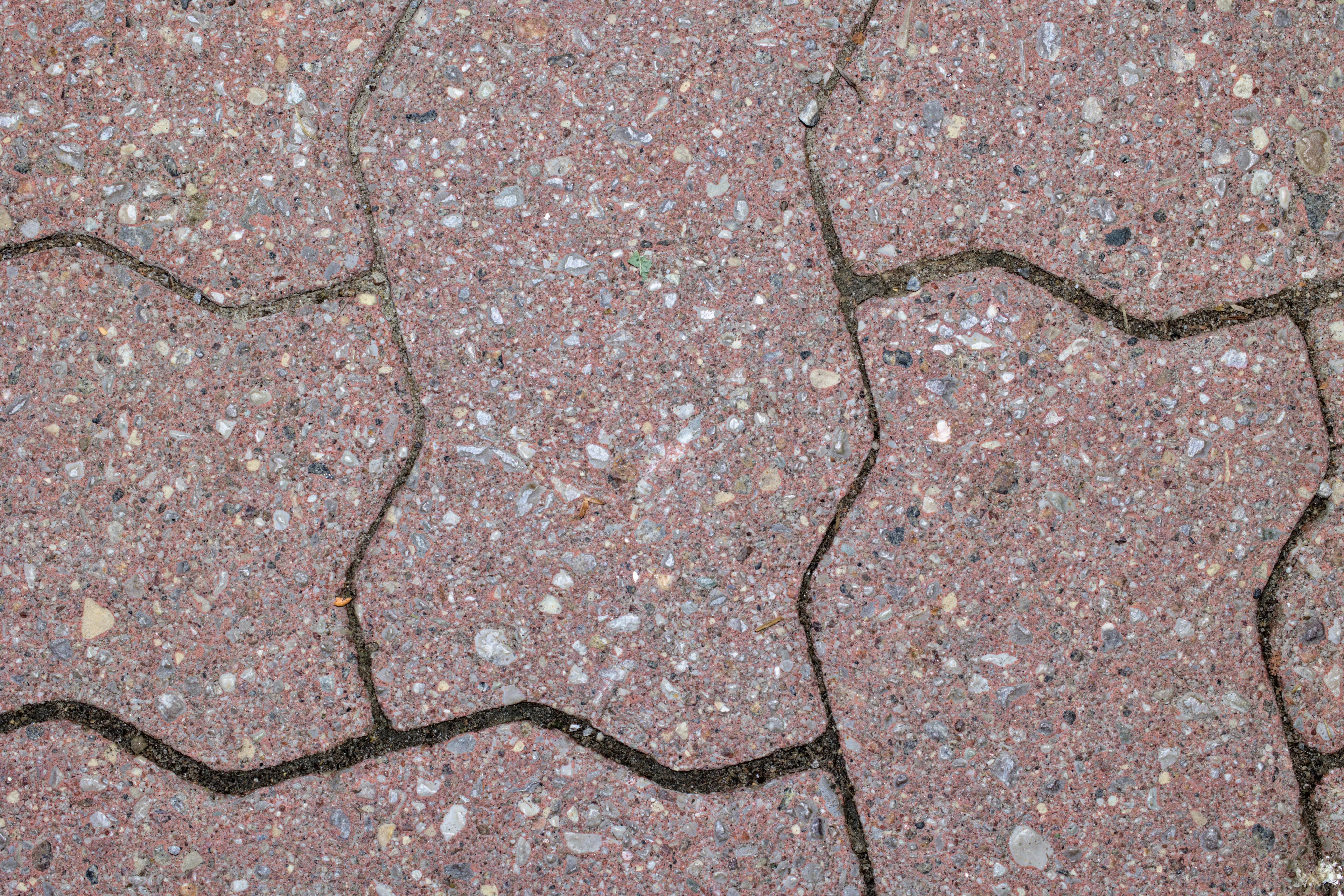 paver patterns Detailed close-up of red brick pavement showcasing unique patterns.