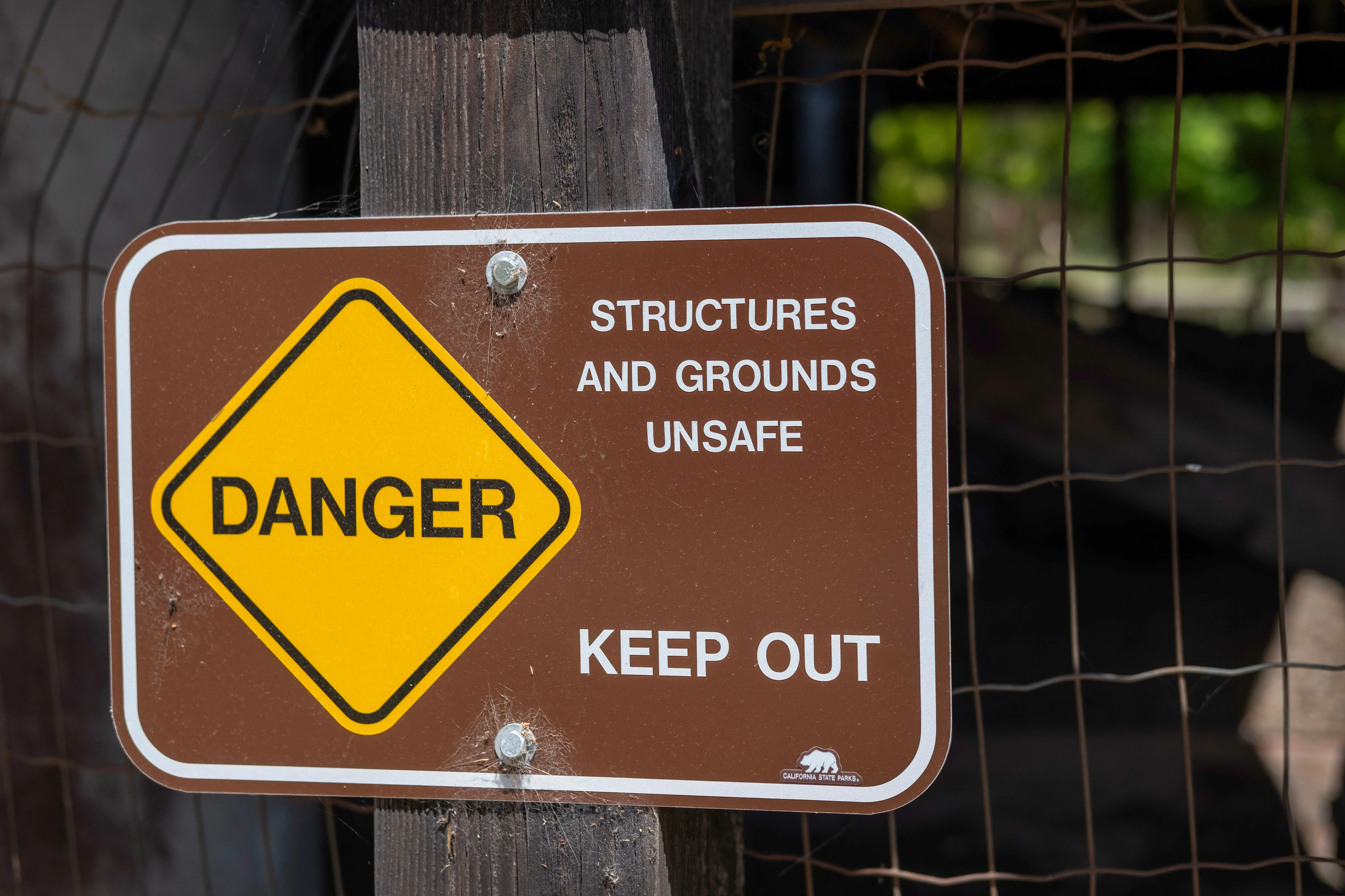 how to catch a rat Danger sign warning about unsafe structures and grounds with keep out notice.