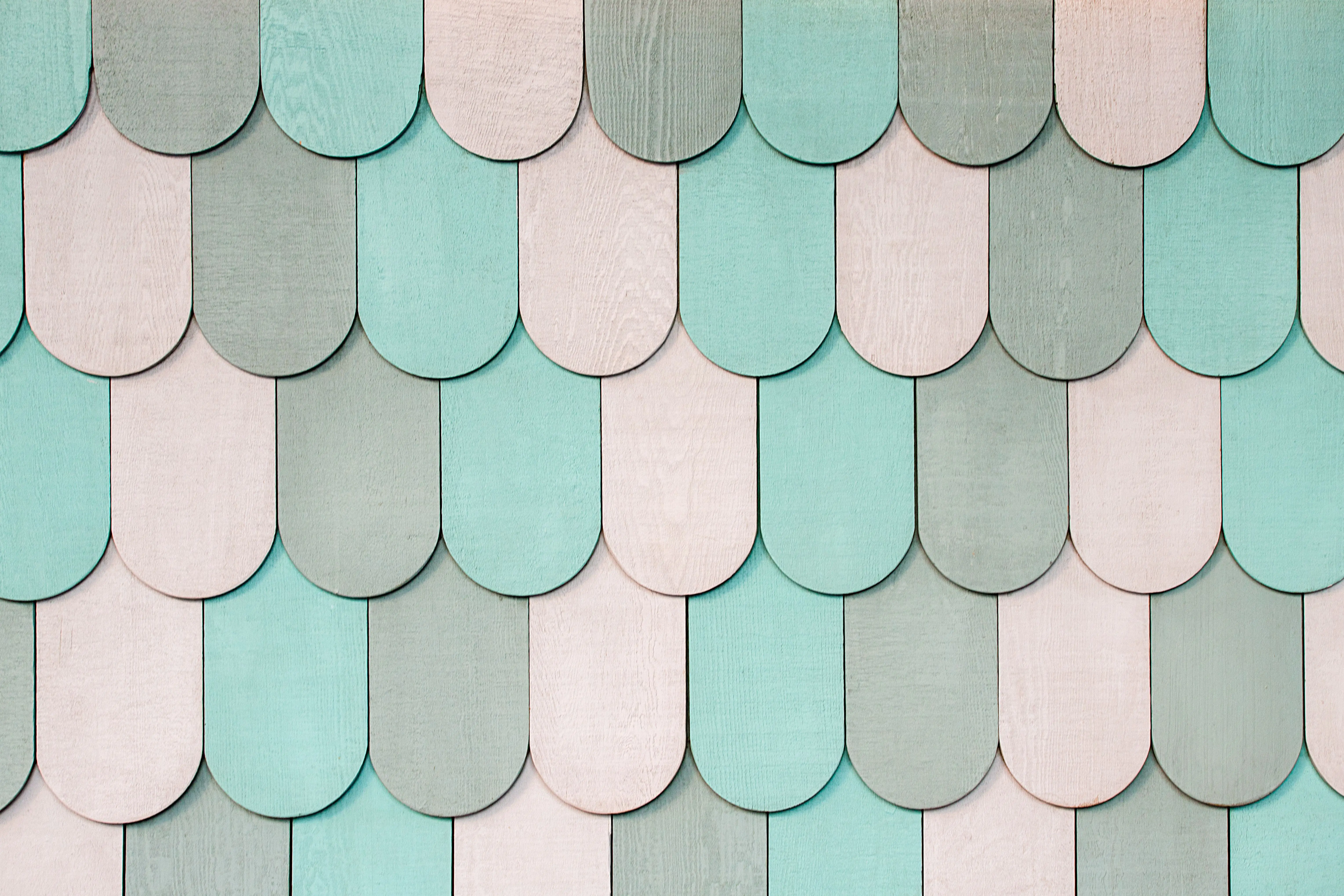 how much does it cost to reside a house Colorful overlapping wooden shingles create a soothing, textured pattern.