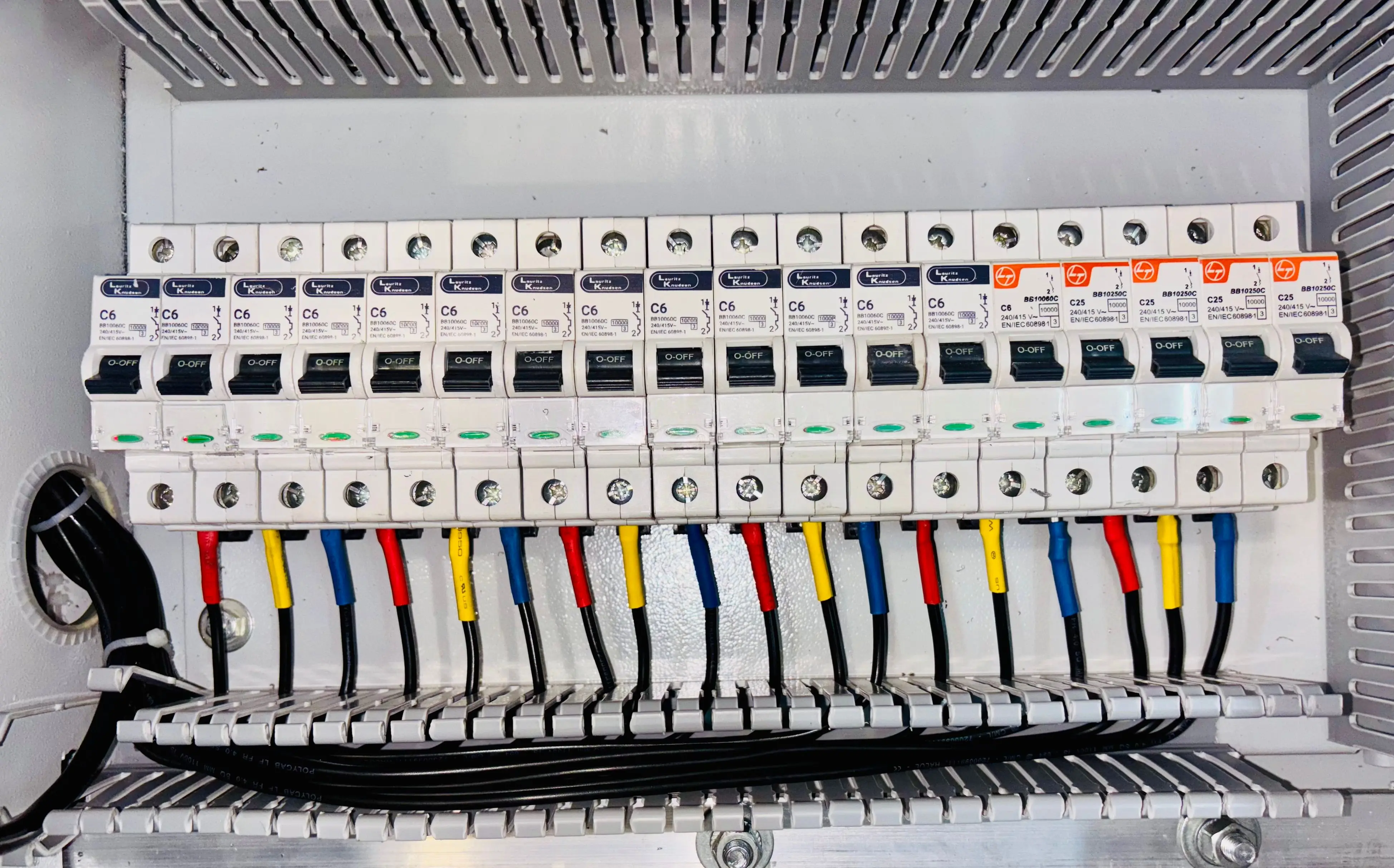 wiring diagram for single light switch Close-up of an organized circuit breaker panel featuring color-coded electrical wiring.