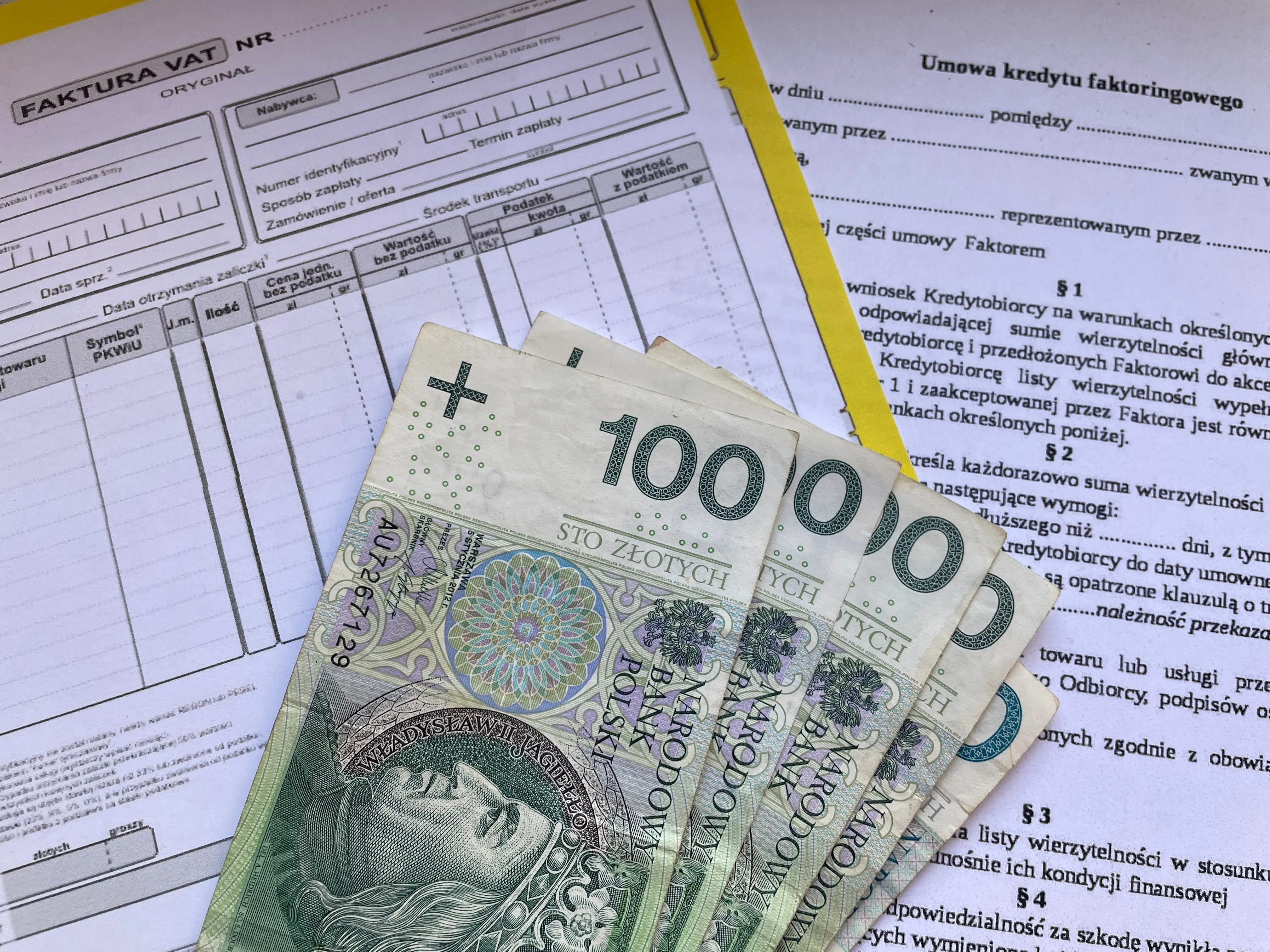 window replacement cost calculator Polish 100 Zloty banknotes on VAT invoice and factoring agreement forms.