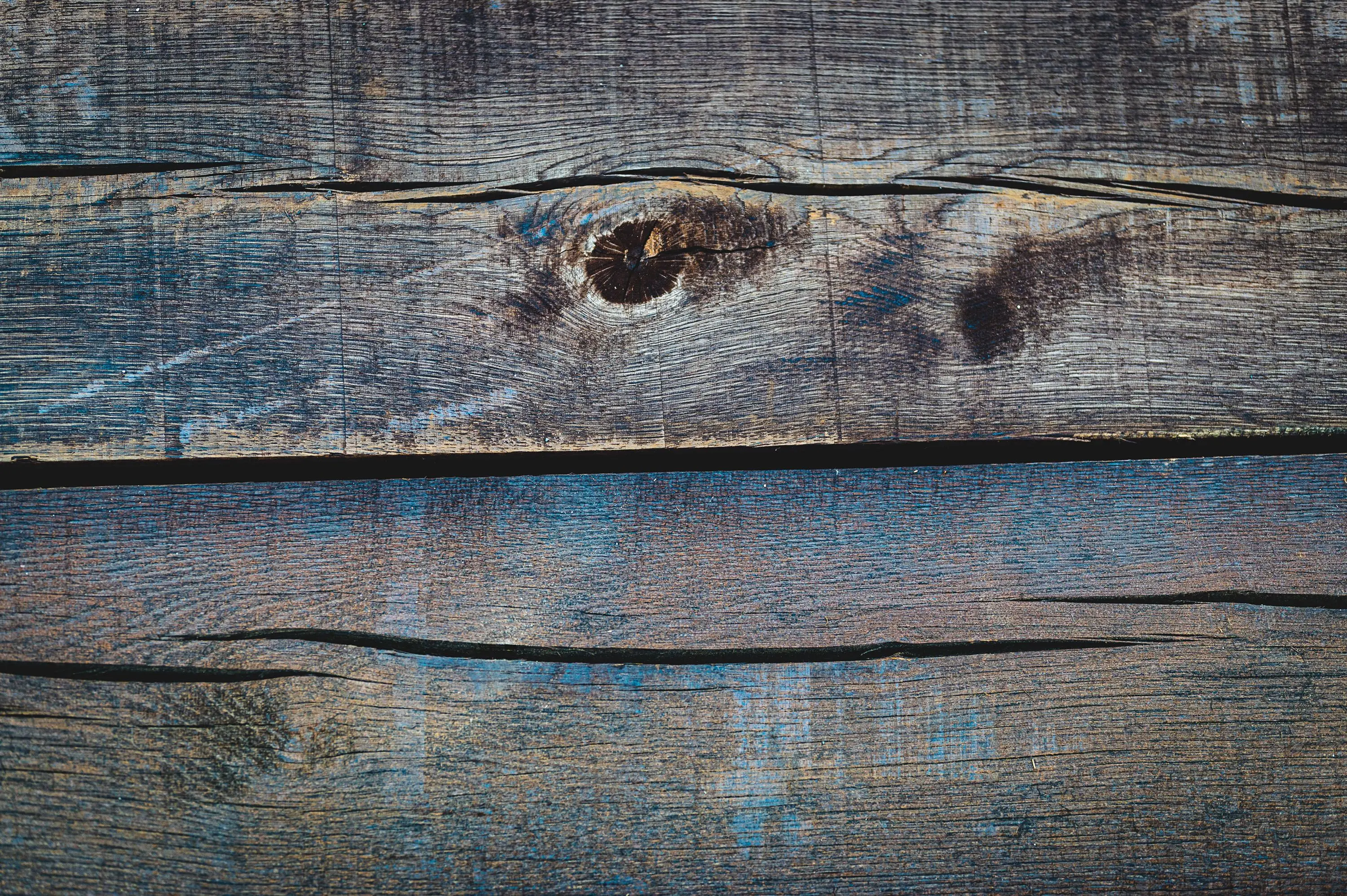 cherry wood kitchen cabinets Rustic and textured close-up of weathered wooden planks, ideal for backgrounds or design projects.