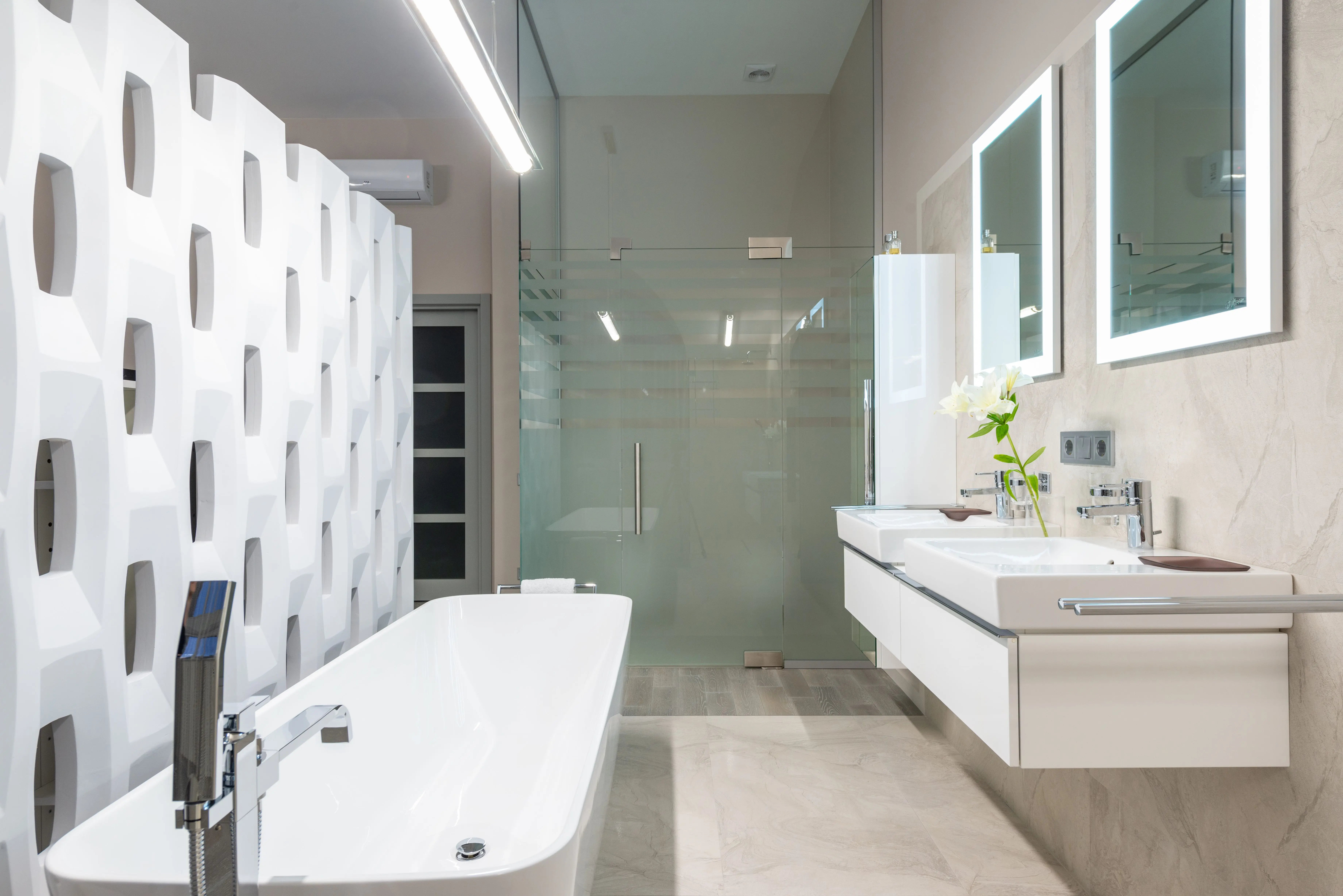small master bathroom designs White bathtub with tap near decorative partition placed near sink and mirrors in stylish light bathroom with glass shower cabin