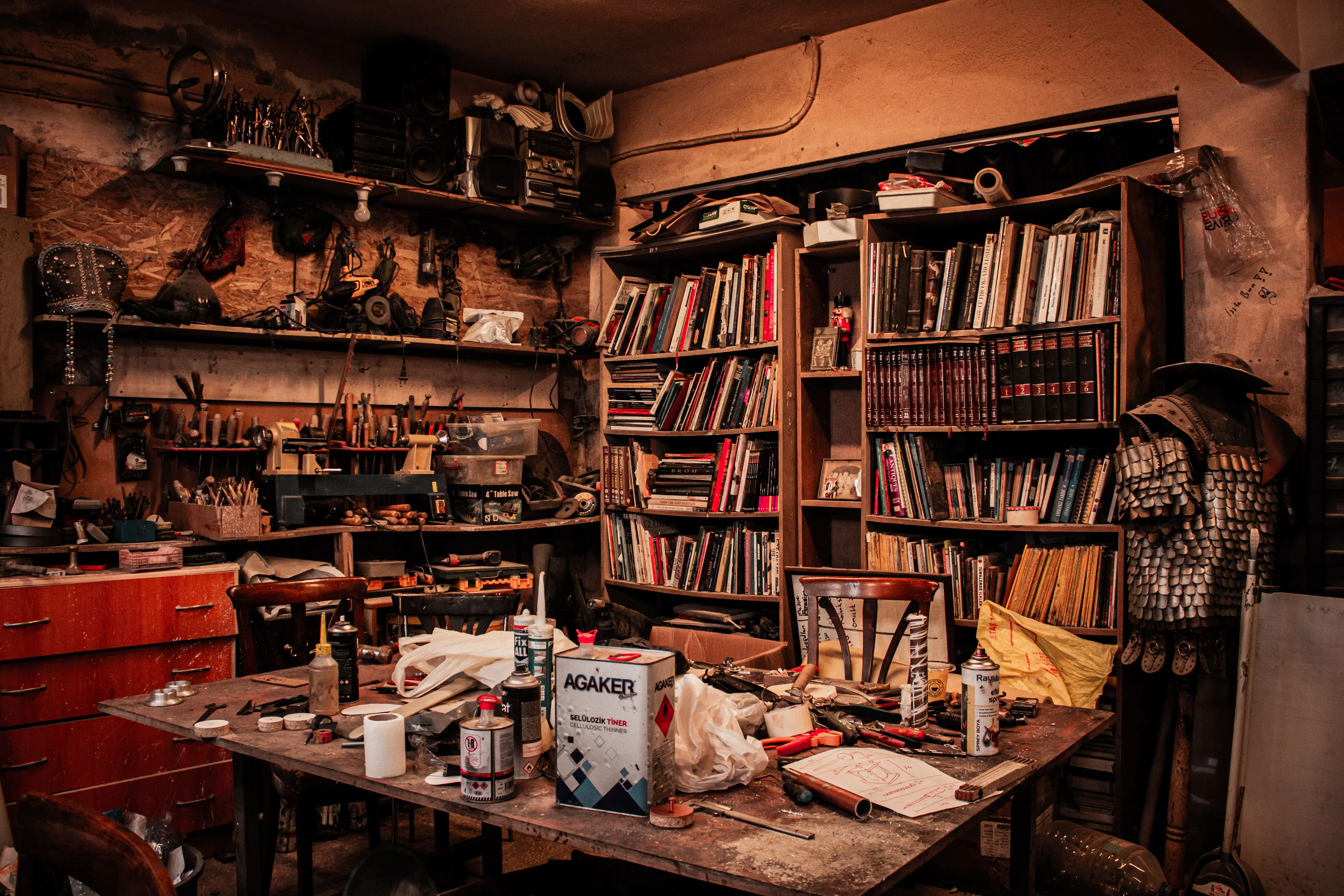 messy house Rustic workshop filled with books, tools, and crafts, creating a warm, creative atmosphere.