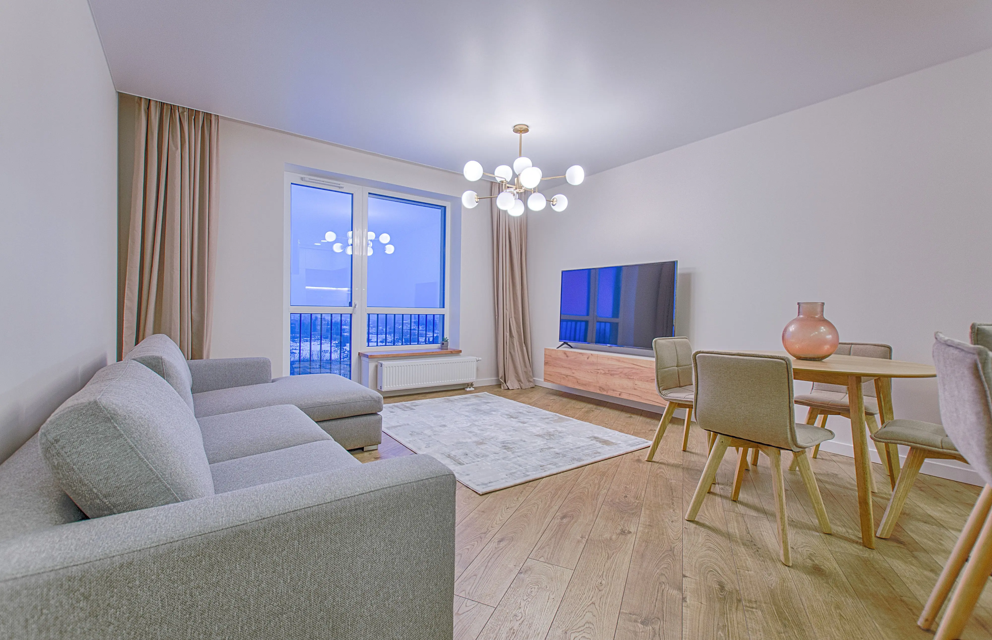 secondary furniture grouping A spacious modern living room featuring stylish furnishings and decor.