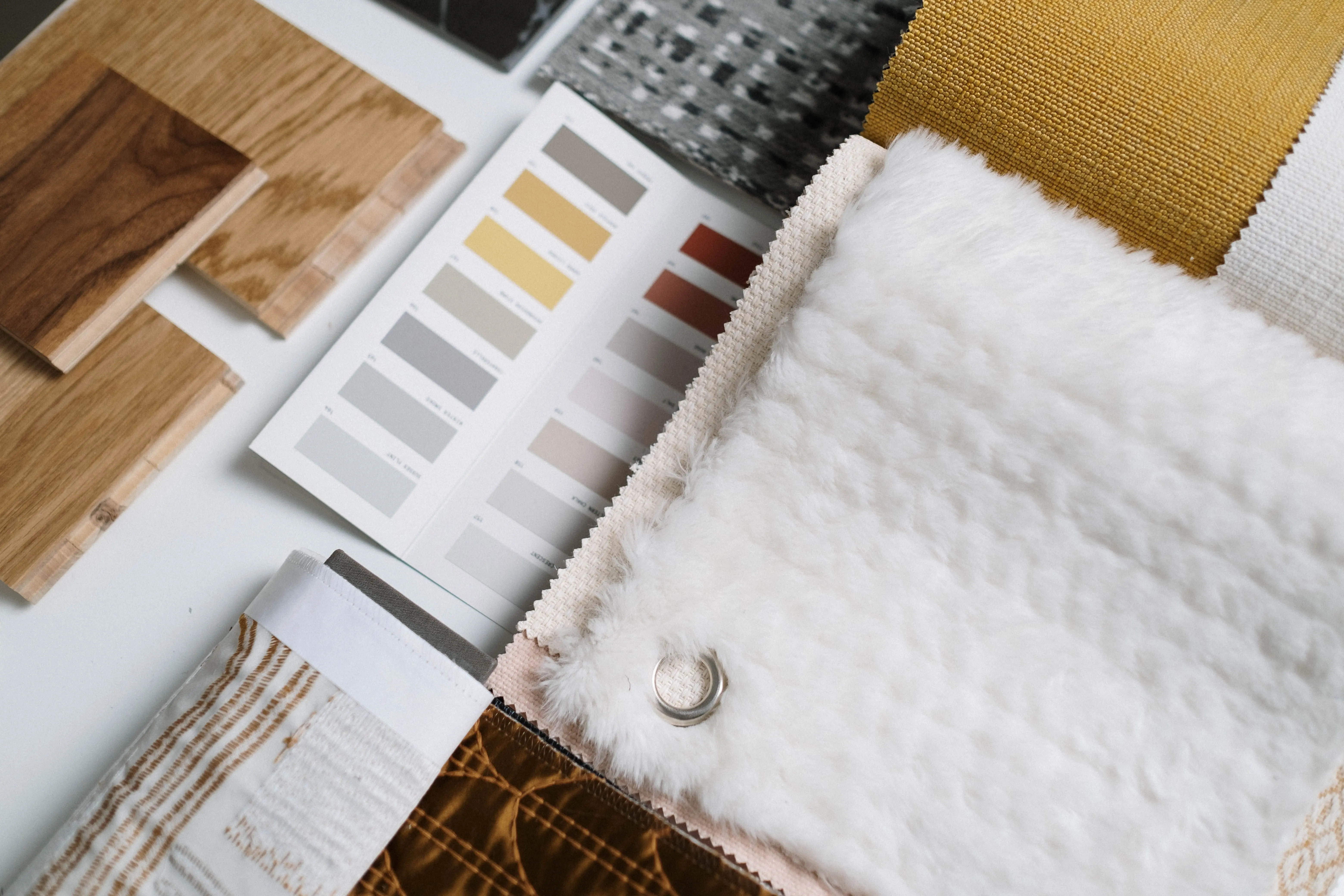 luxury home renovations A flat lay of color swatches and fabric samples ideal for interior design inspiration.