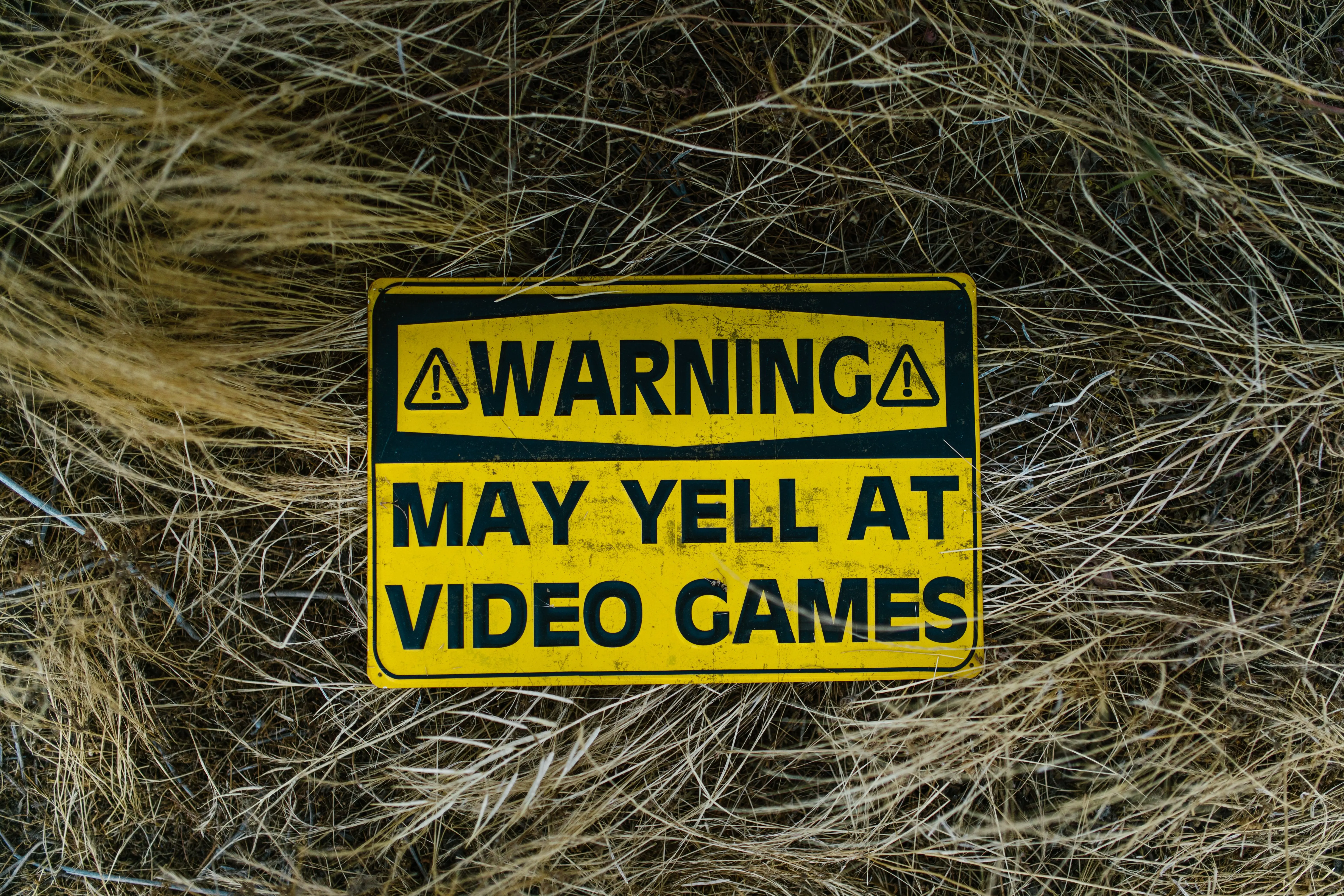 just one bite rat poison A funny yellow warning sign on grass reading 'Warning May Yell at Video Games'.