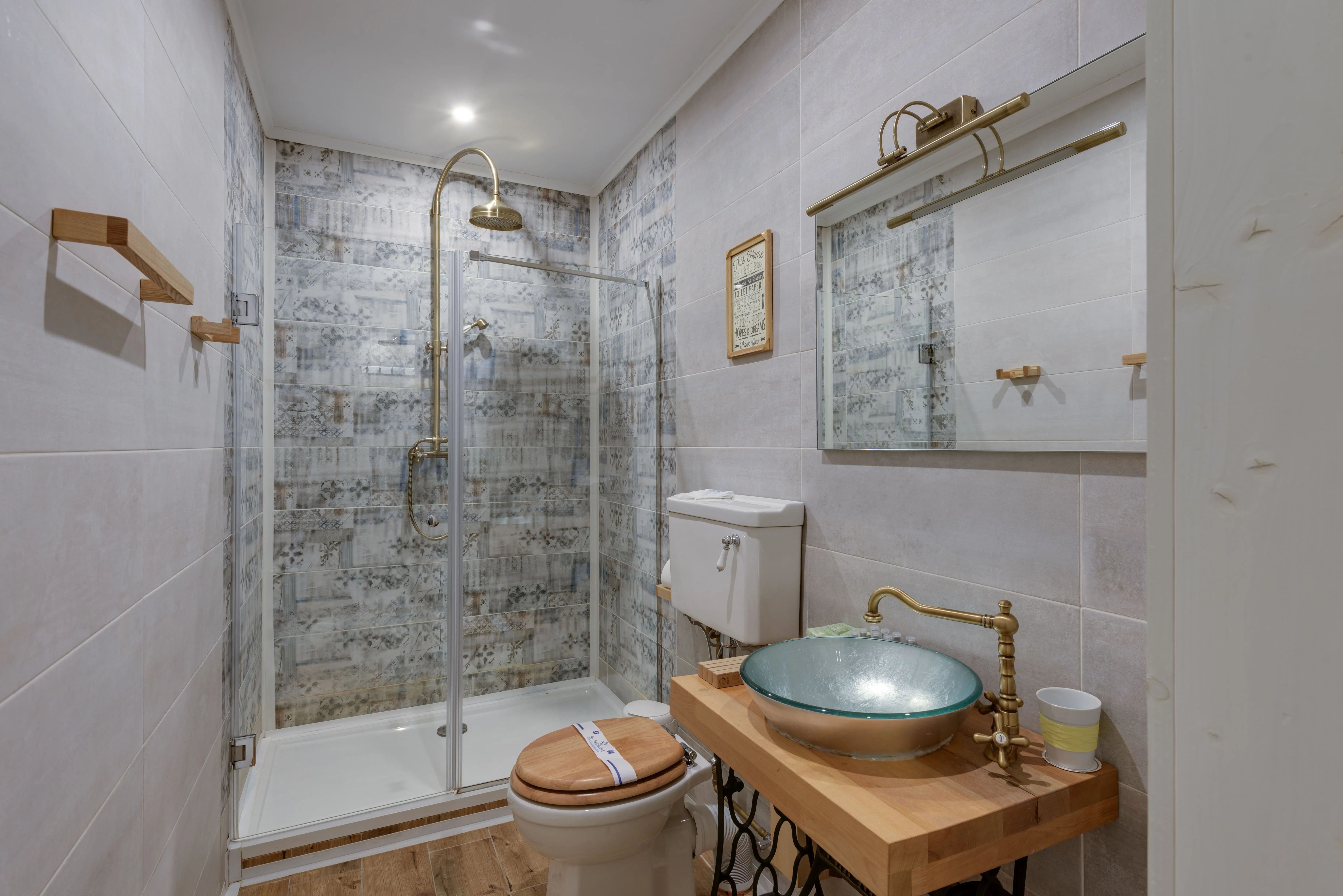shower to bathtub conversion A stylish modern bathroom featuring a glass shower, vessel sink, and wood accents.