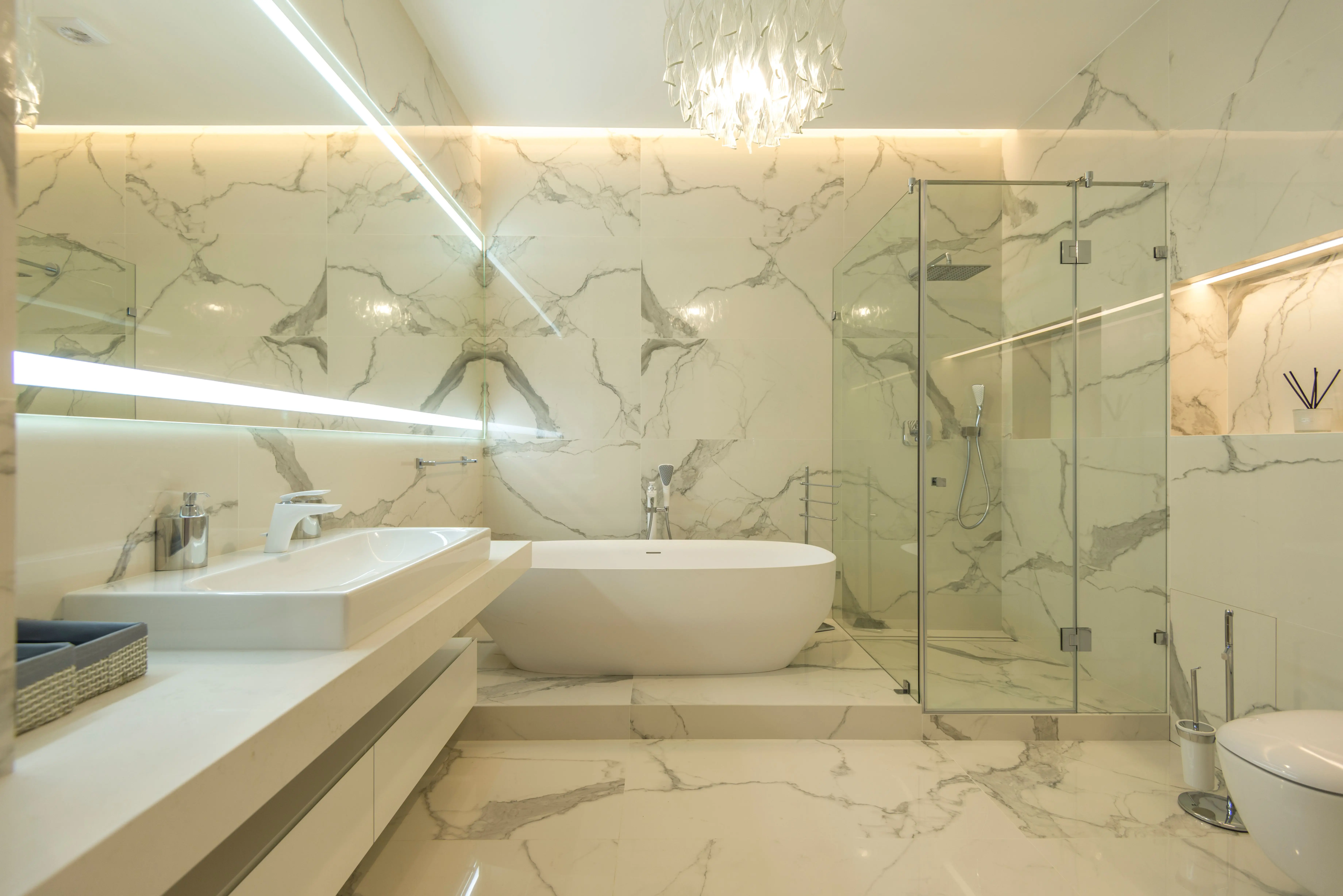 tub inside shower Elegant and modern marble bathroom with freestanding tub and glass shower.