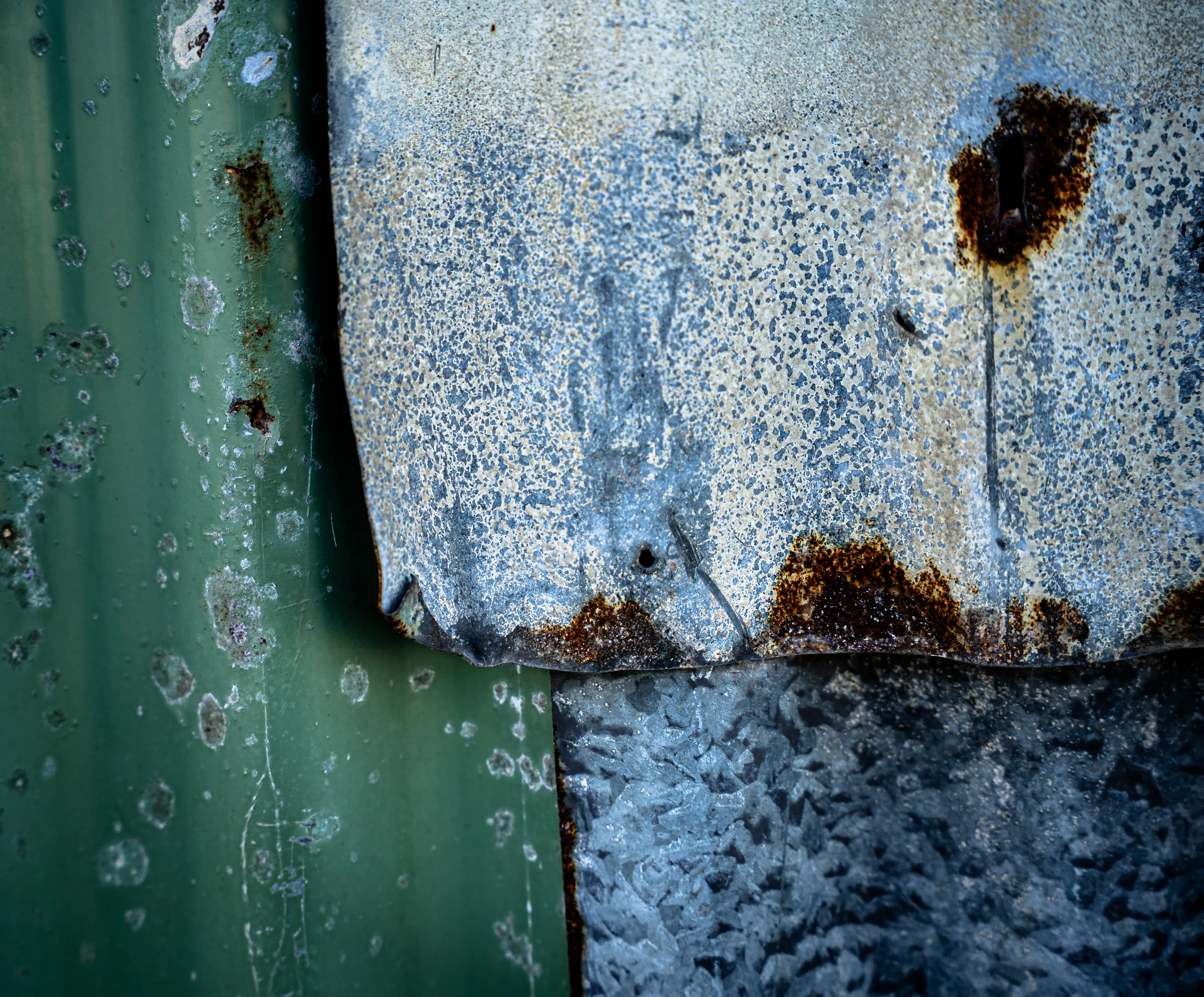 pvc fence gate Detailed texture of rusty and weathered corrugated metal, showcasing patina and decay.