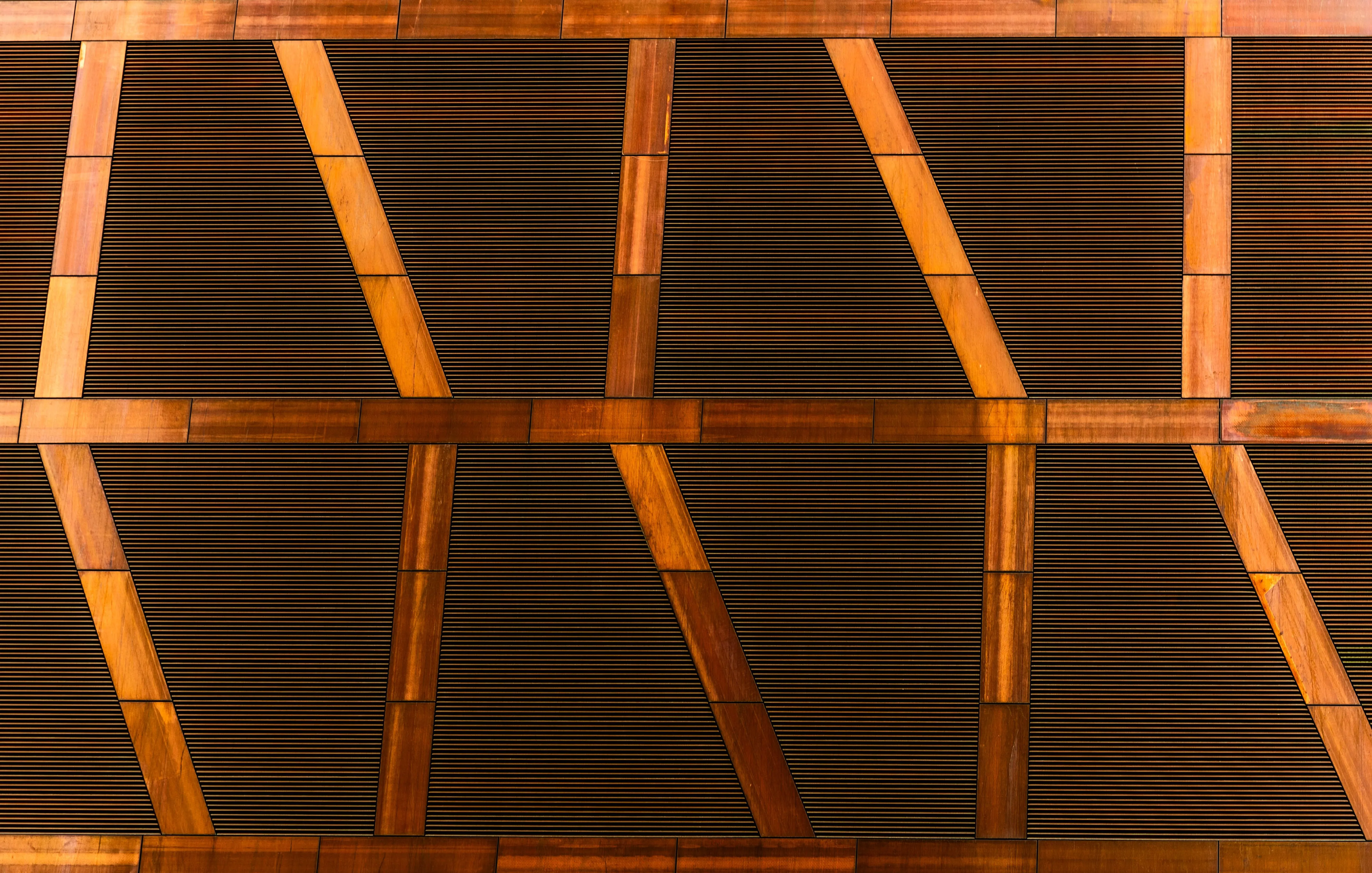 contemporary kitchen backsplash Detailed geometric pattern on a wooden interior wall, showcasing modern architectural design.