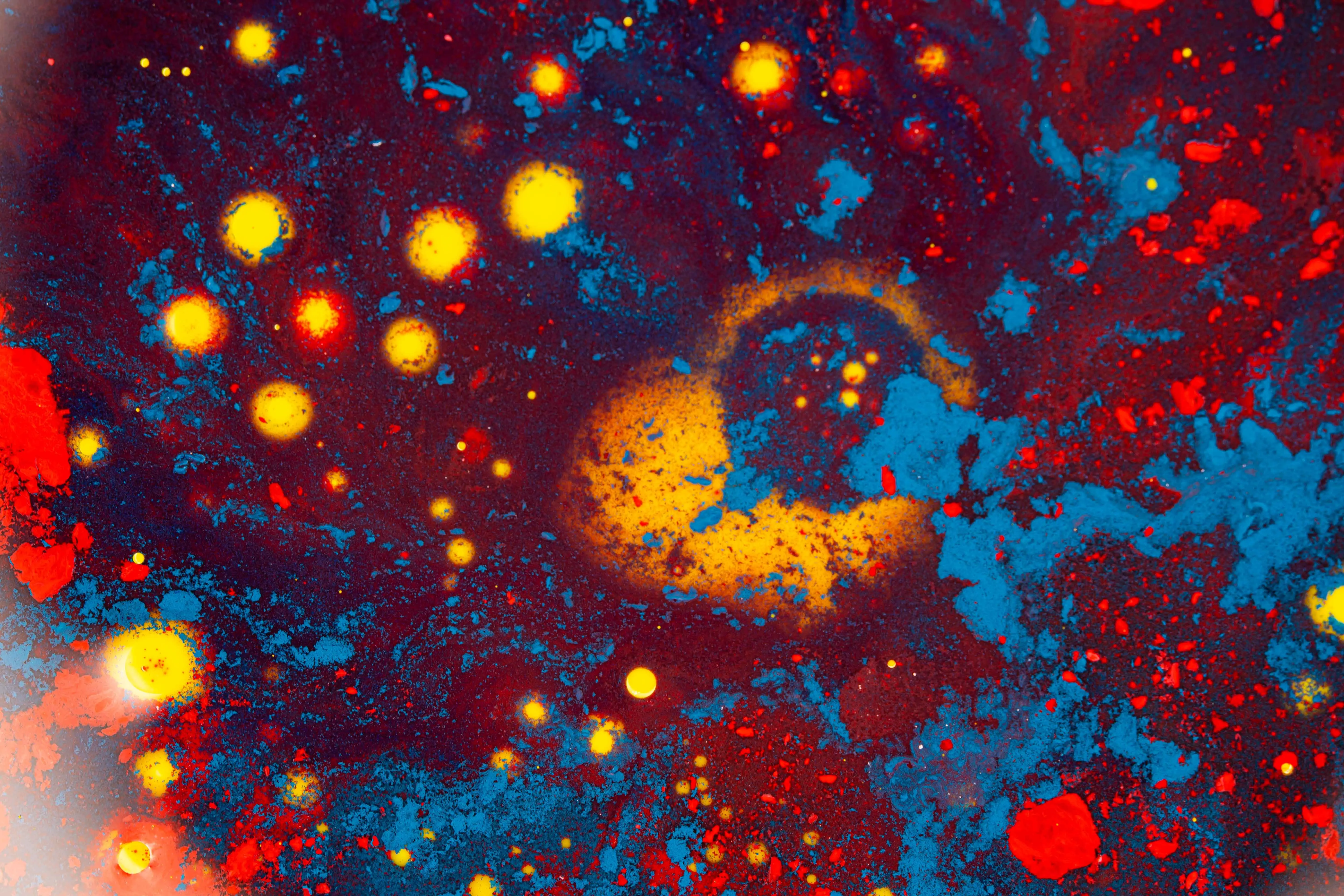abstract prints A vivid abstract pattern resembling a cosmic scene with colorful textures and patterns.