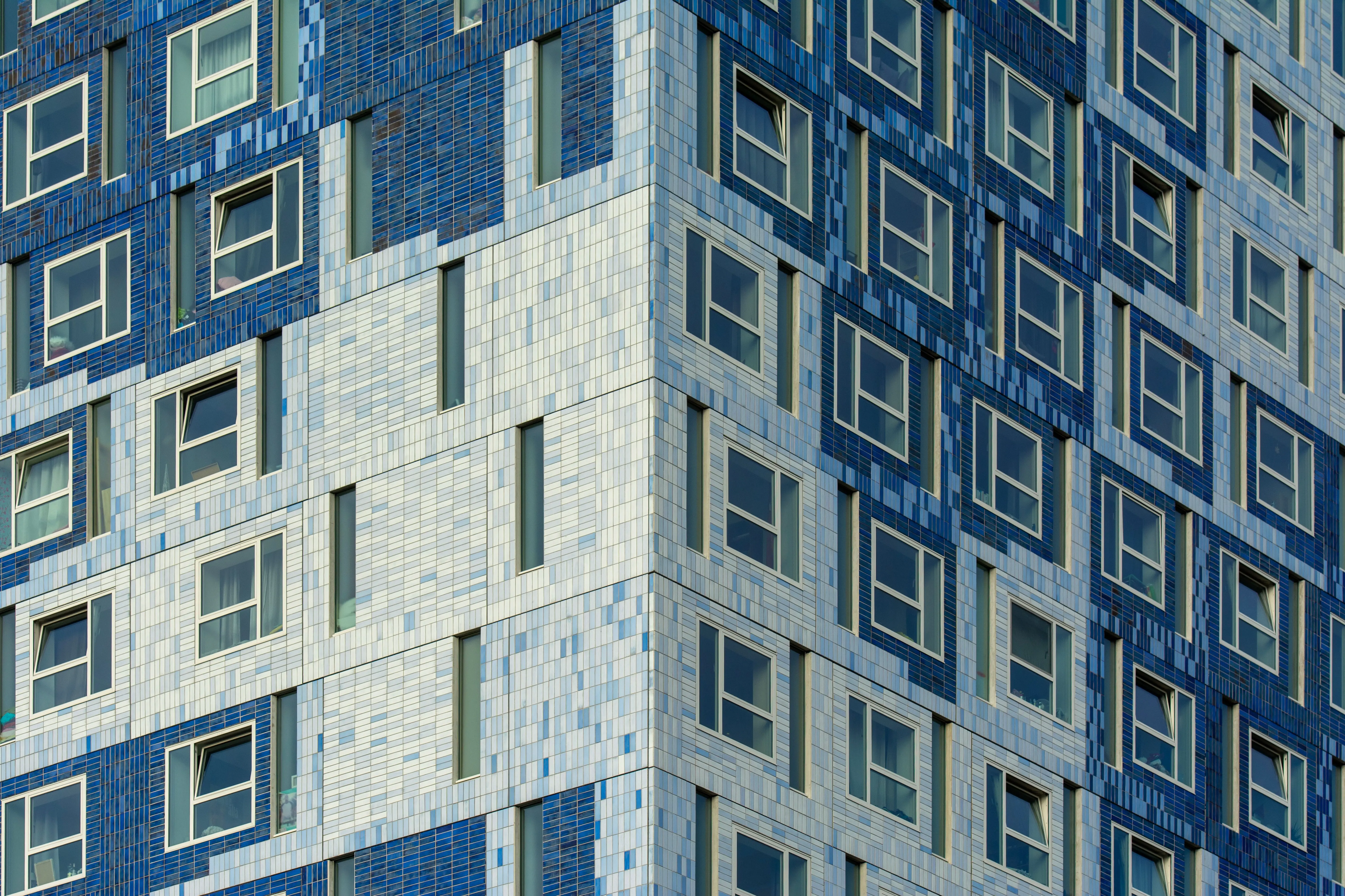 blue subway tile Close-up of a vibrant building facade in Utrecht showcasing modern architecture.
