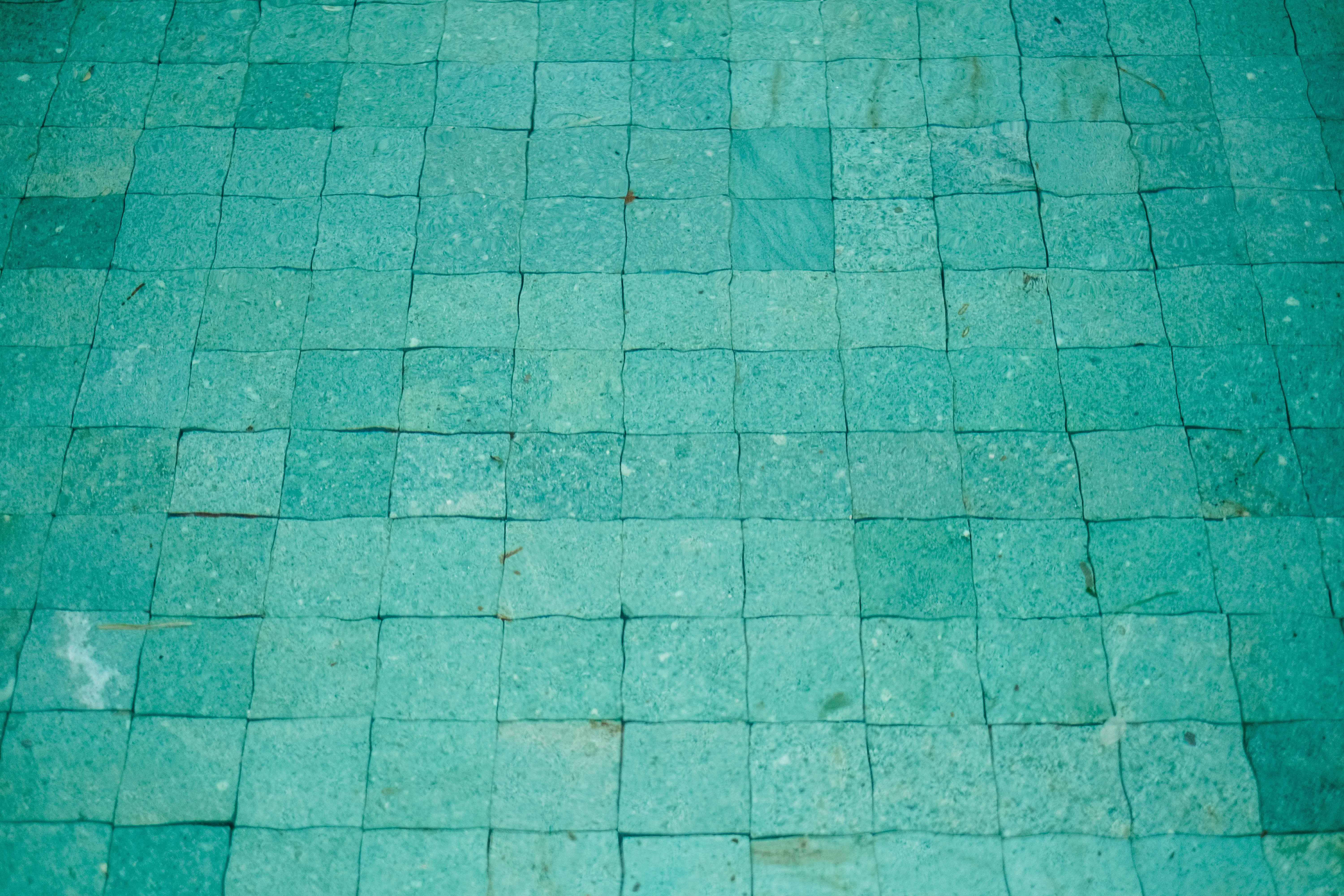 blue backsplash Close-up of an aqua blue textured tile mosaic, ideal for backgrounds or design elements.