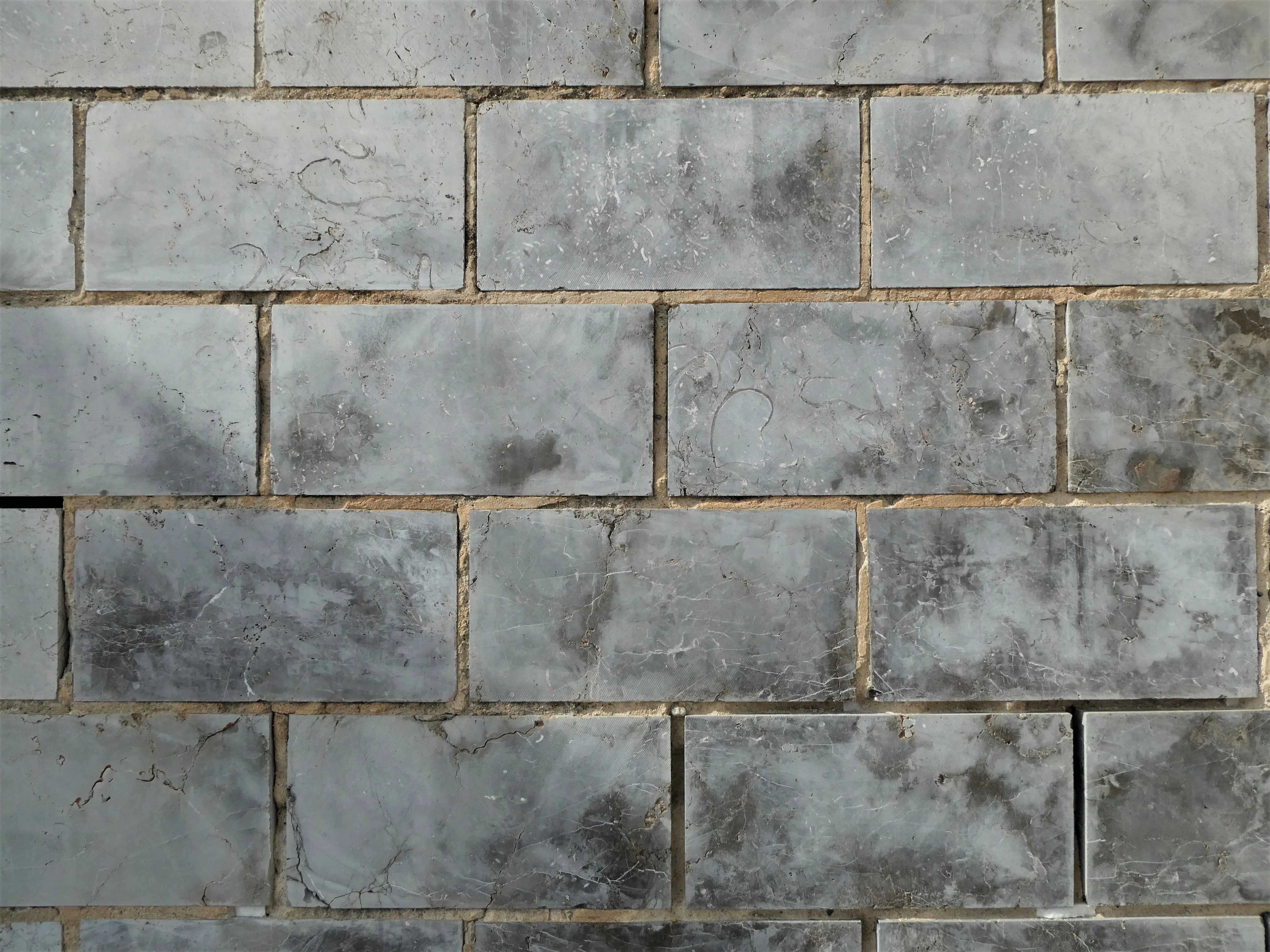 blue floor tile Close-up of textured ceramic wall tiles forming a uniform pattern.