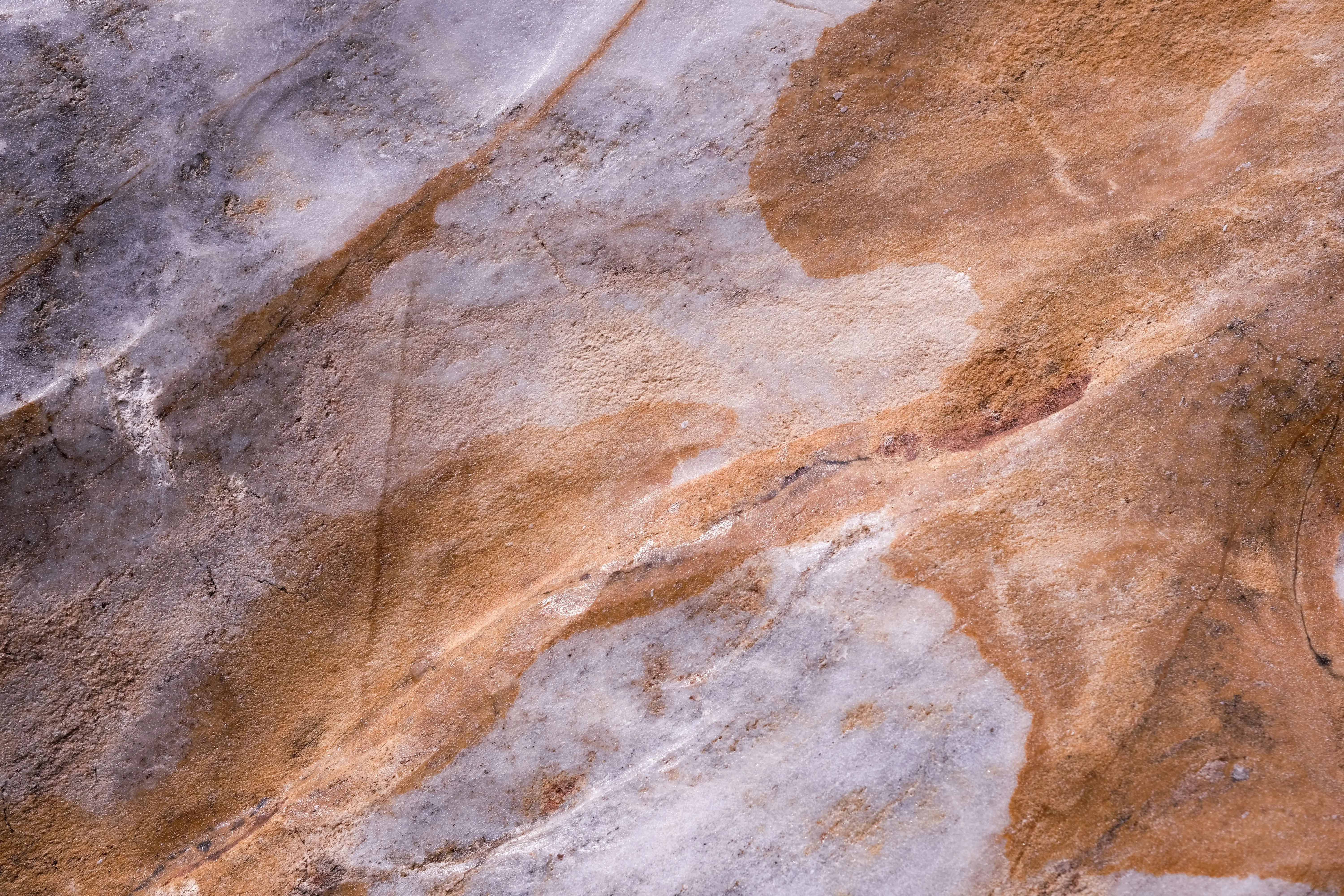 cinnamon slate Close-up of a natural stone surface displaying rich textures and earthy colors.