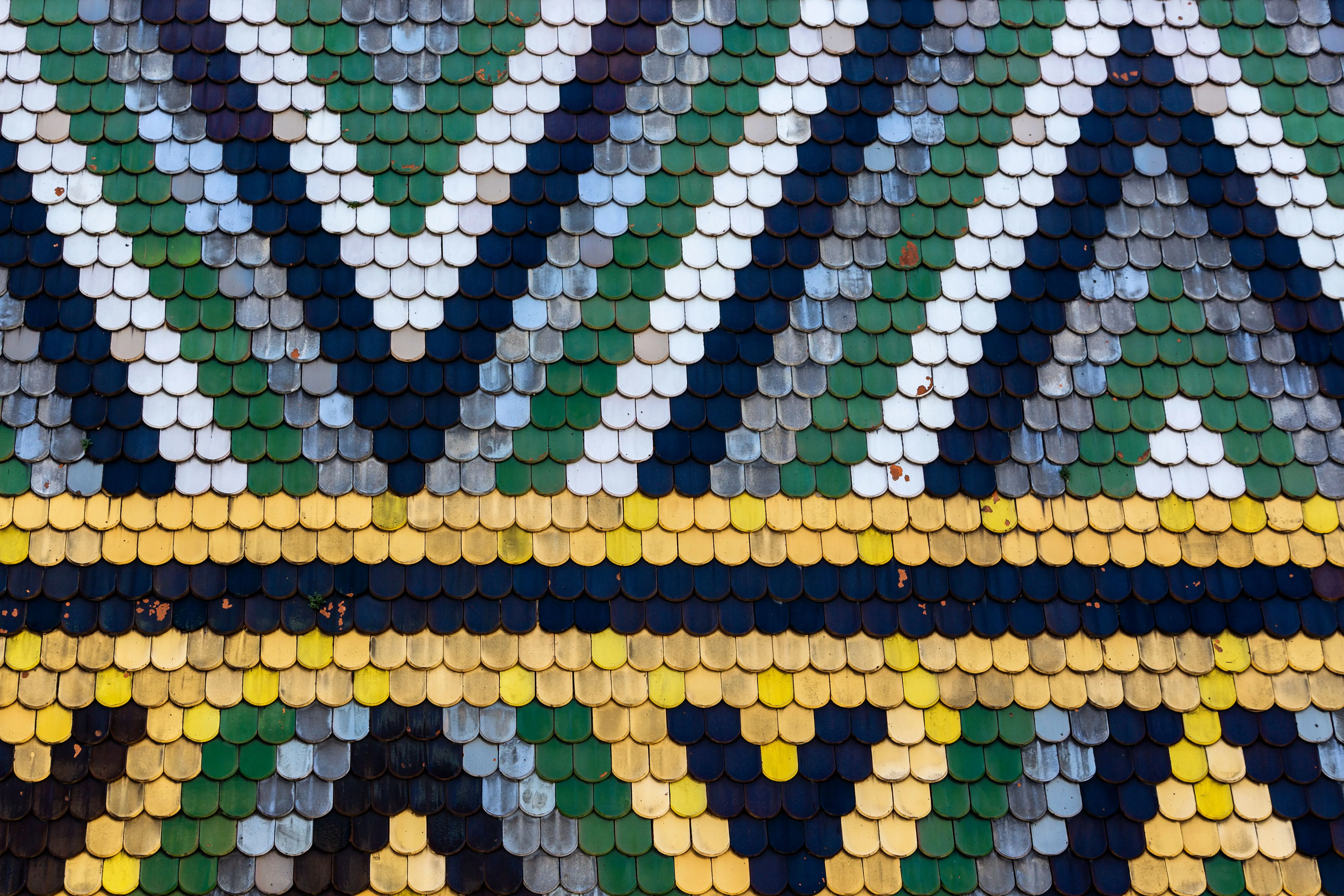 decorative tile Vibrant geometric pattern of colored tiles on a roof showcasing artistic detail.