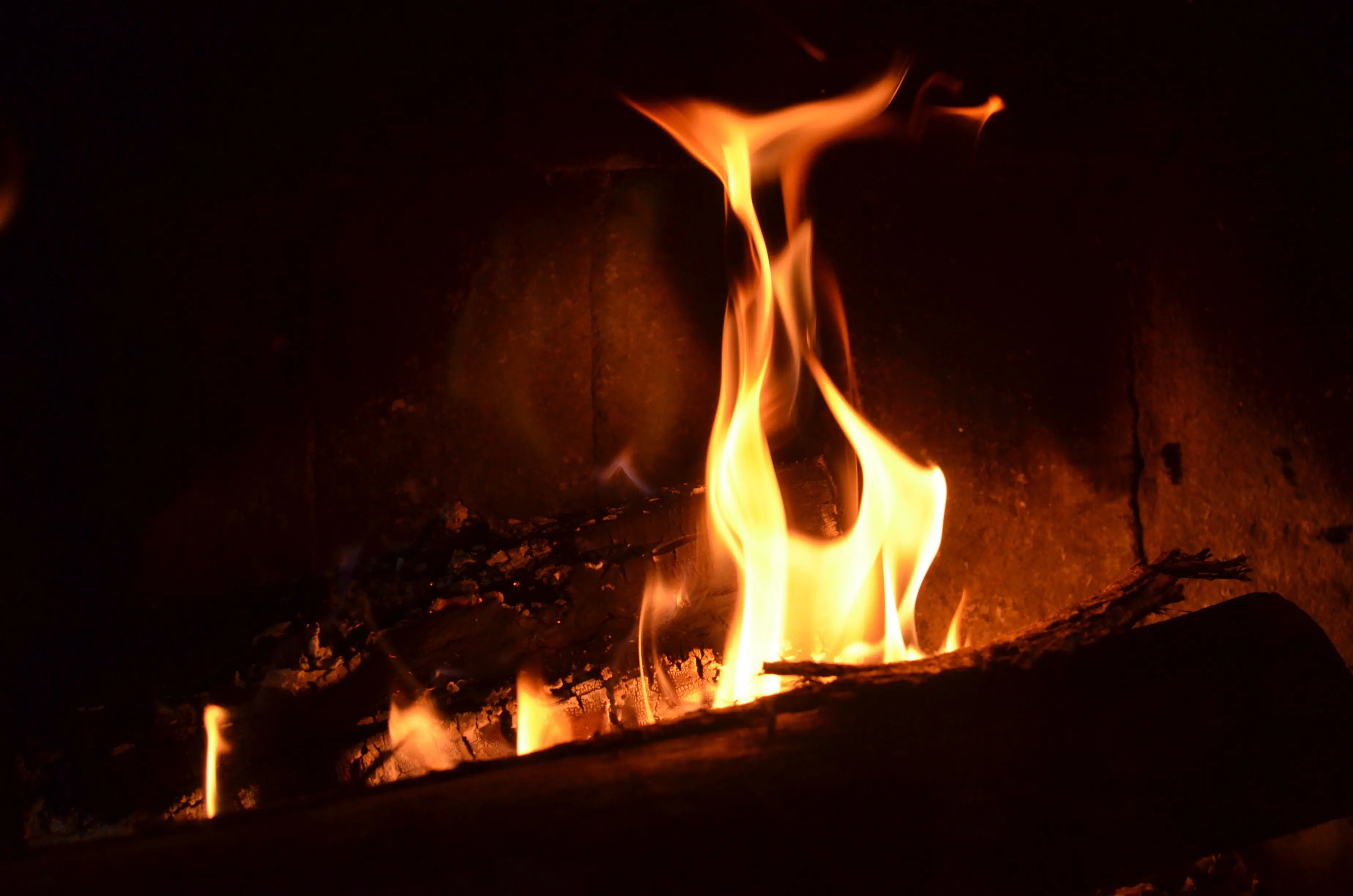 diy outdoor fireplace Close-up view of fireplace flames creating a warm and cozy ambiance.