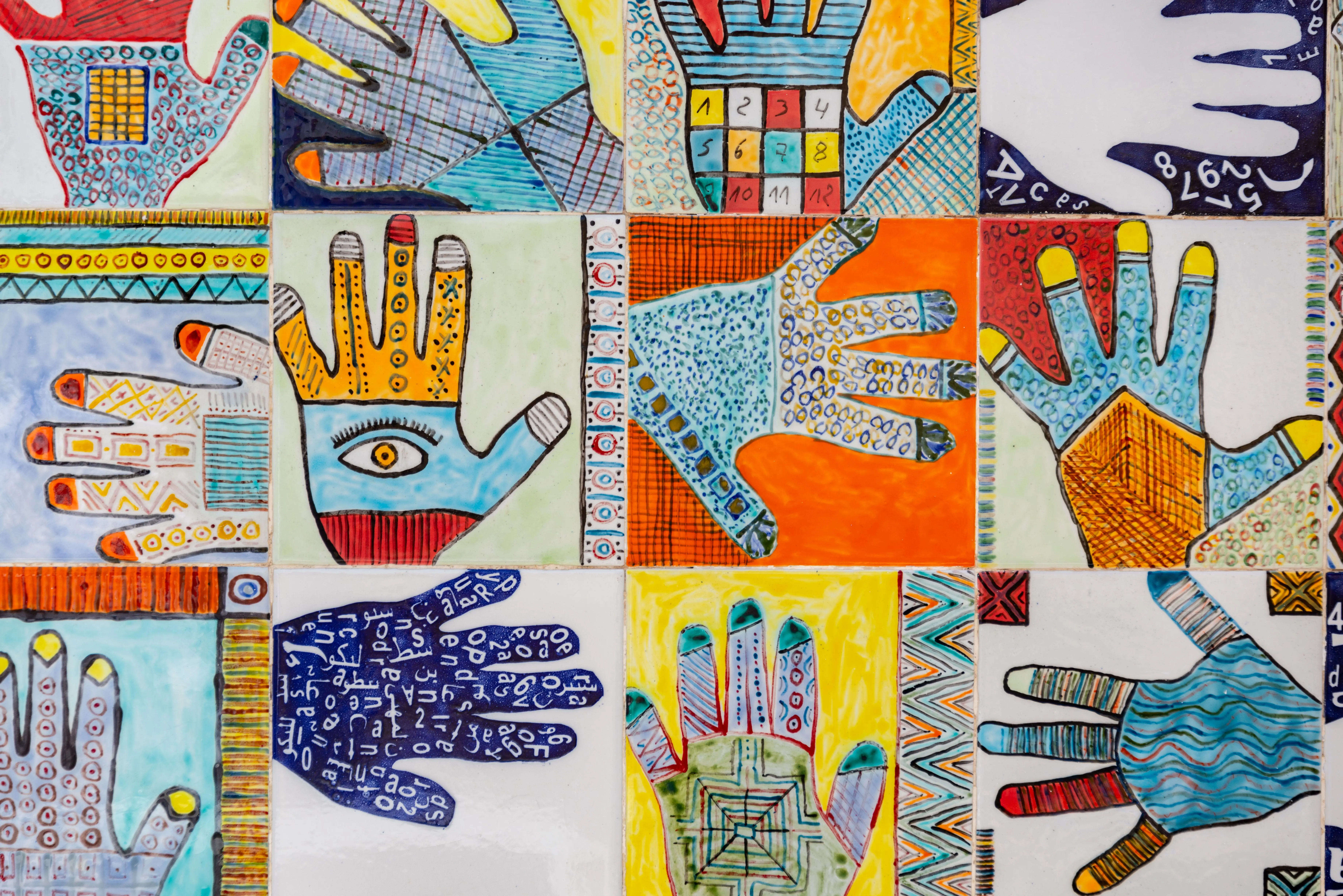 christmas handprint crafts Vibrant collage of hand illustrations featuring geometric patterns on tiles.