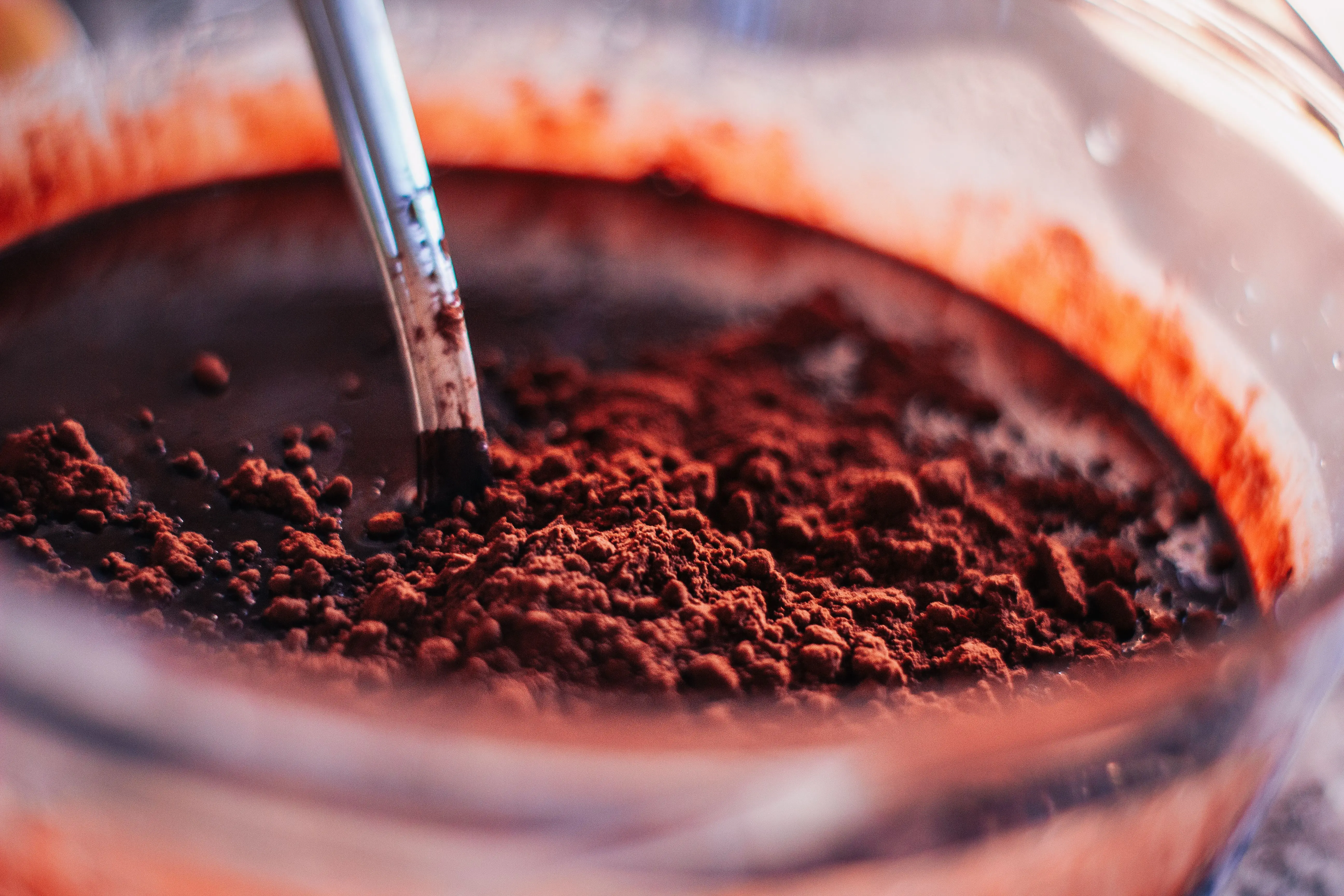 diy laundry detergent powder Detailed close-up shot of cocoa powder being mixed in a clear glass bowl, perfect for baking enthusiasts.